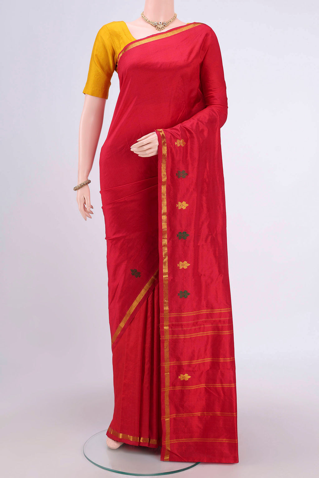 Red Kanchipuram Silk Saree with Plain Body and Zari Border.  displayed on a mannequin