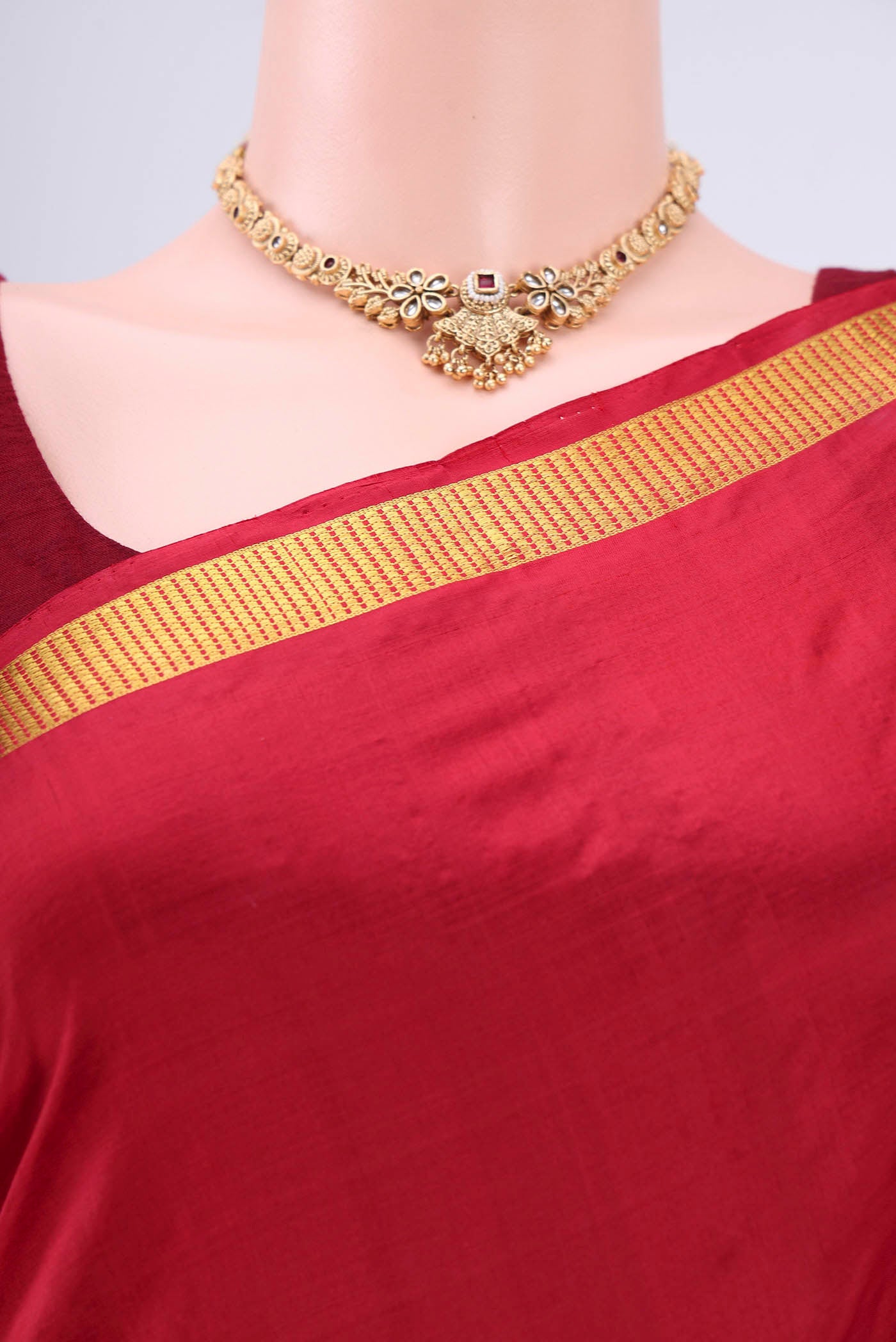 Border image of Maroon Kanchipuram Saree with Plain Body and Zari Border. 