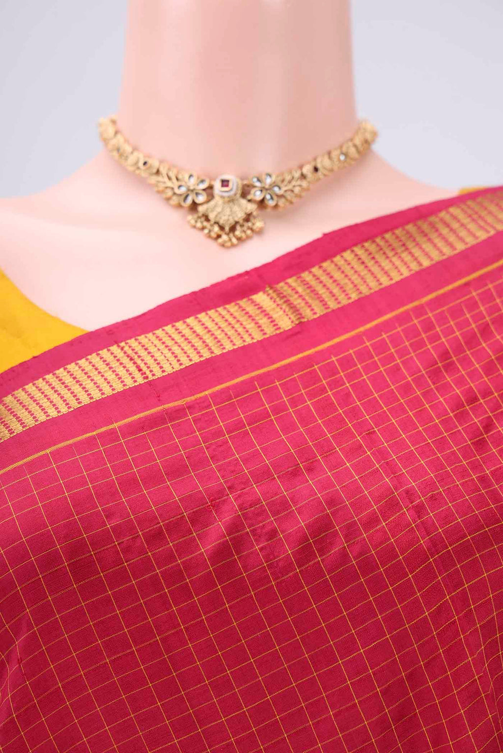 Border image of Maroon Dual Tone Kanchipuram Silk Saree with Checked design on the body and Zari Border. 