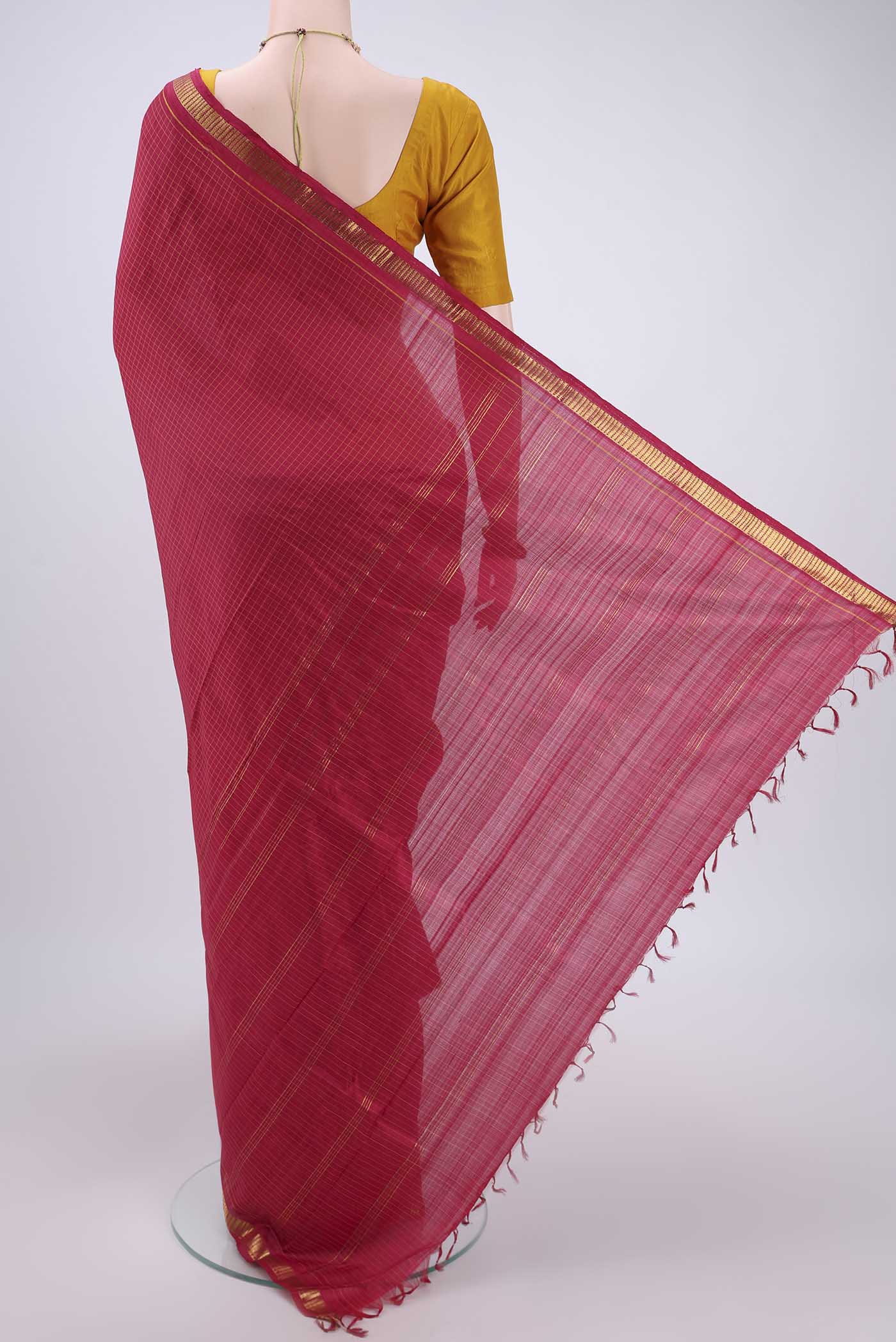 Flat view of Maroon Dual Tone Kanchipuram Silk Saree with Checked design on the body and Zari Border. 