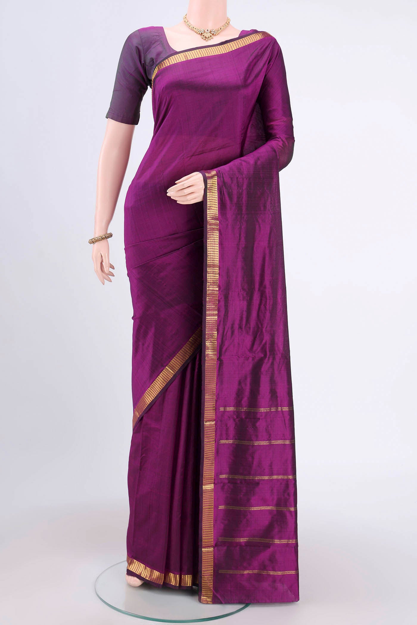 Purple Kanchipuram Saree with Plain Body and Zari Border.  displayed on a mannequin