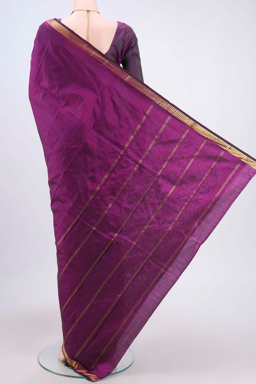 Flat view of Purple Kanchipuram Saree with Plain Body and Zari Border. 