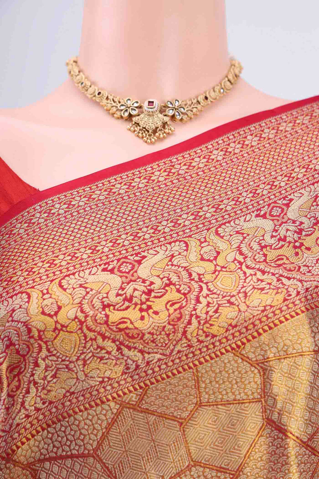Border image of Maroon Kanchipuram Saree with Zari Brocade on the body and Zari Border. 