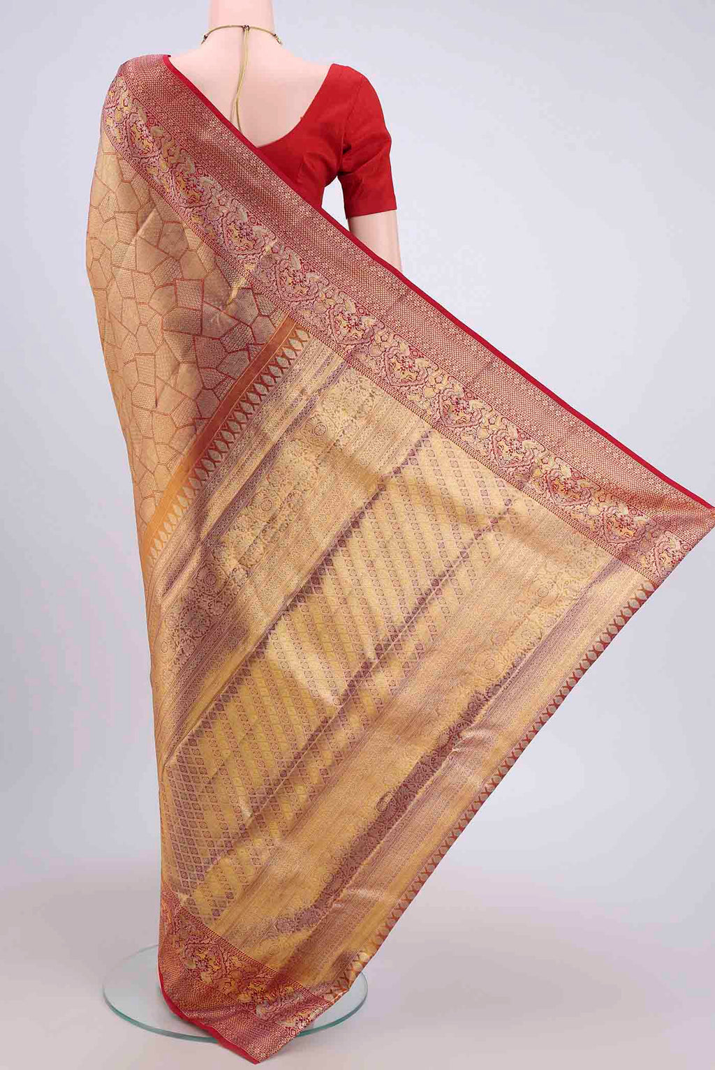 Flat view of Maroon Kanchipuram Saree with Zari Brocade on the body and Zari Border. 