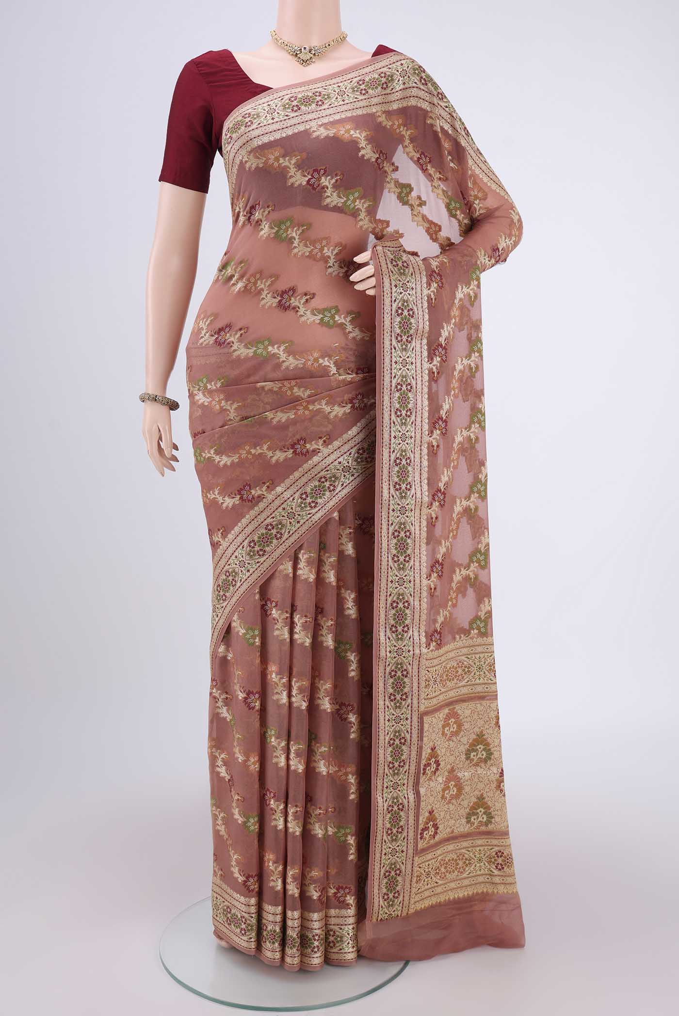 Rose Gold Blended Banarasi Georgette Saree with Thread Brocade on the body and Thread Border.  displayed on a mannequin