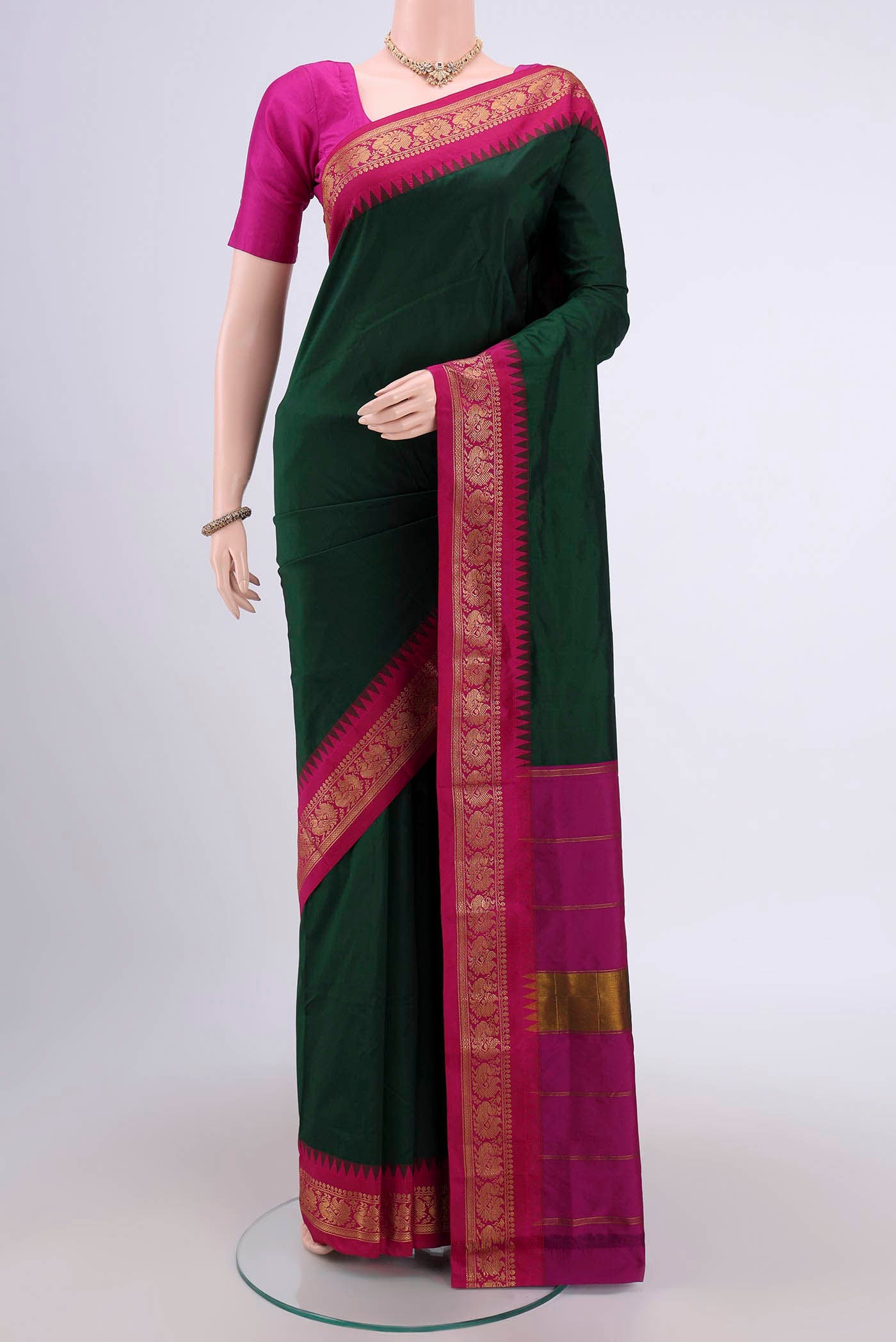 Bottle Green Dual Tone Blended Bangalore Silk Saree with Plain Body and Zari Border.  displayed on a mannequin