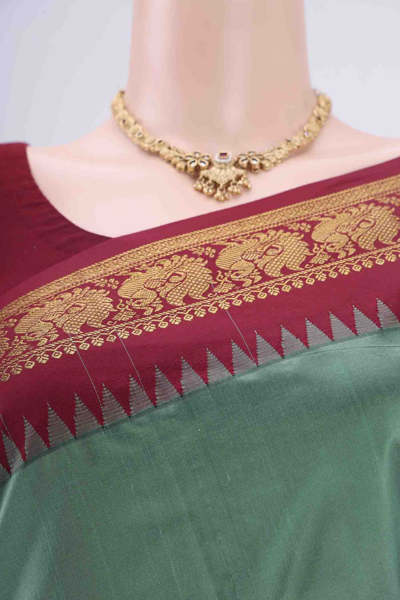 Border image of Sage Green Blended Bangalore Silk Saree with Zari Butta on the body and Zari Border. 