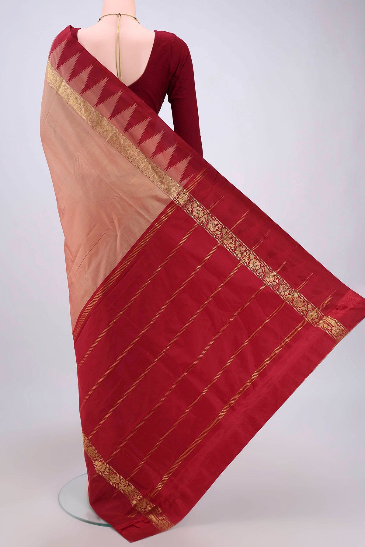 Flat view of Coral Blended Bangalore Silk Saree with Zari Butta on the body and Temple Border. 
