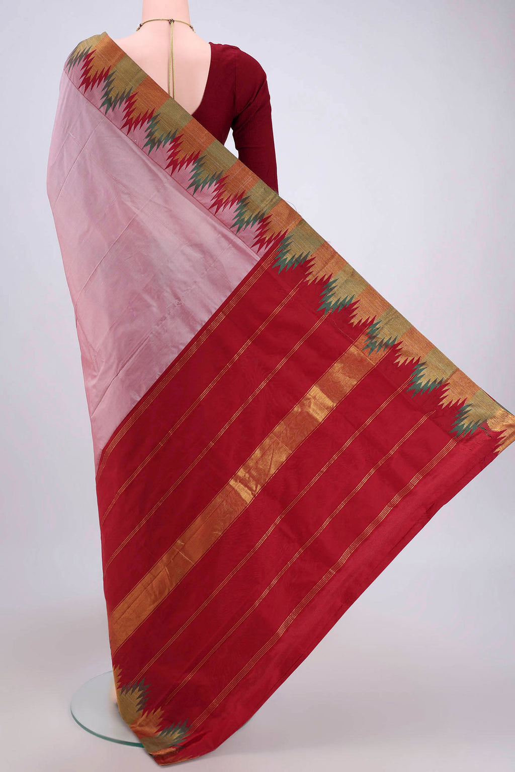 Flat view of Coral Blended Bangalore Silk Saree with Zari Butta on the body and Temple Border. 