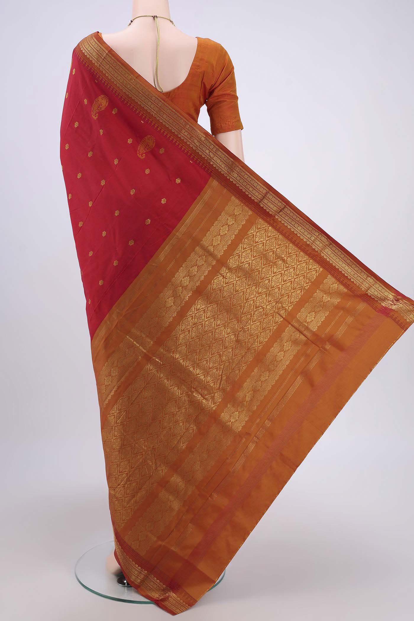 Flat view of Red Dual Tone Blended Bangalore Silk Saree with Zari Butta on the body and Temple Border. 