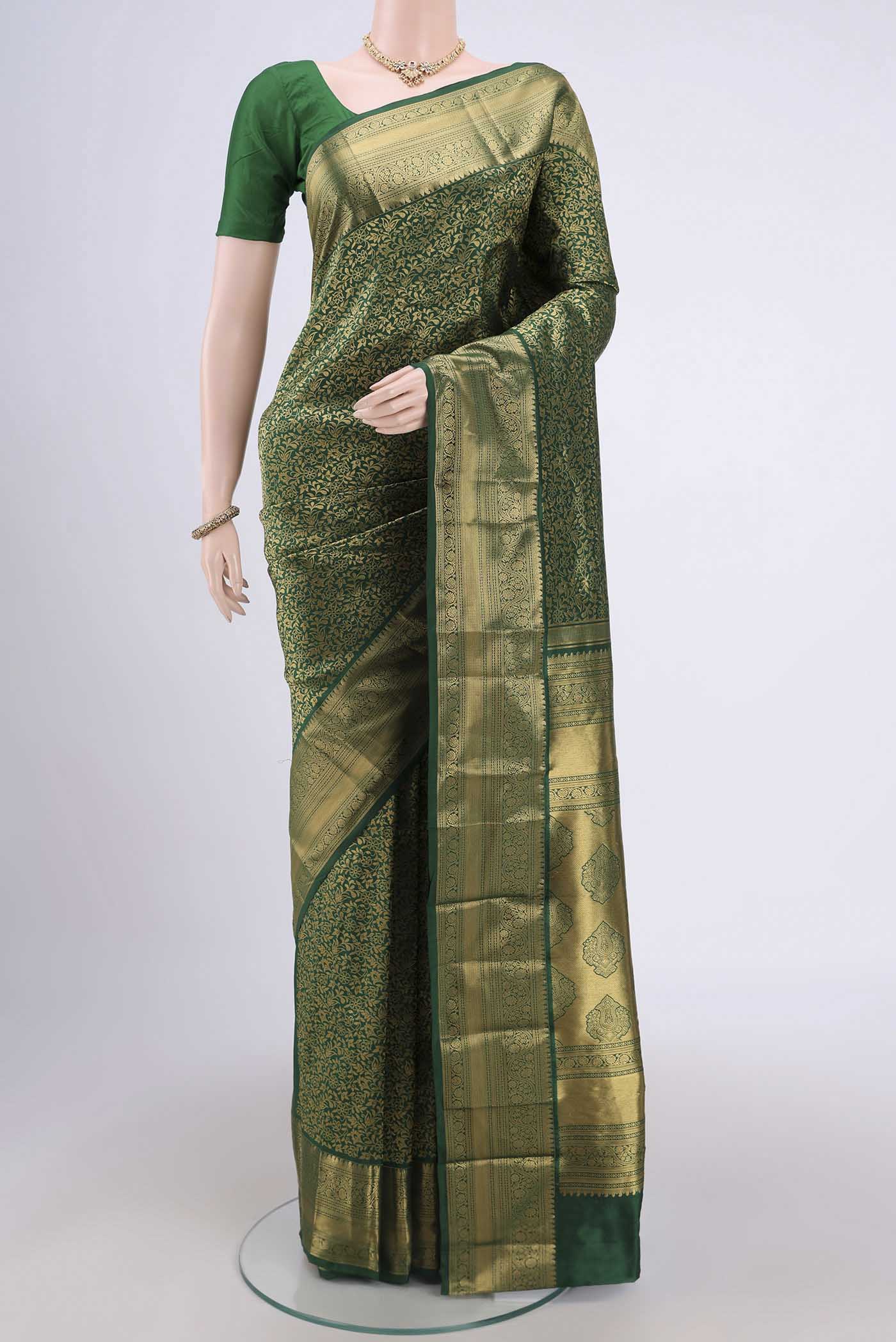 Green Bangalore Silk Saree with Zari Brocade on the body and Zari Border.  displayed on a mannequin
