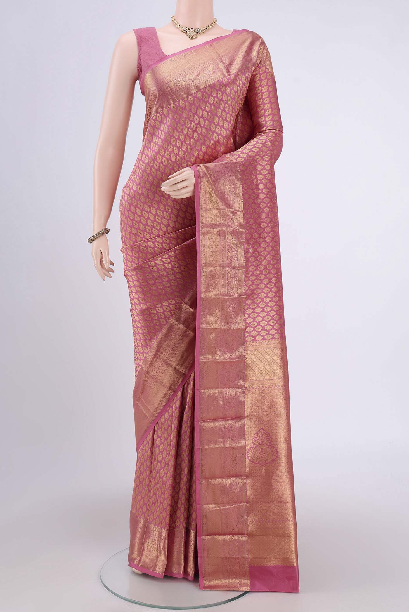 Rose pink Bangalore Silk Saree with Zari Brocade on the body and Zari Border.  displayed on a mannequin