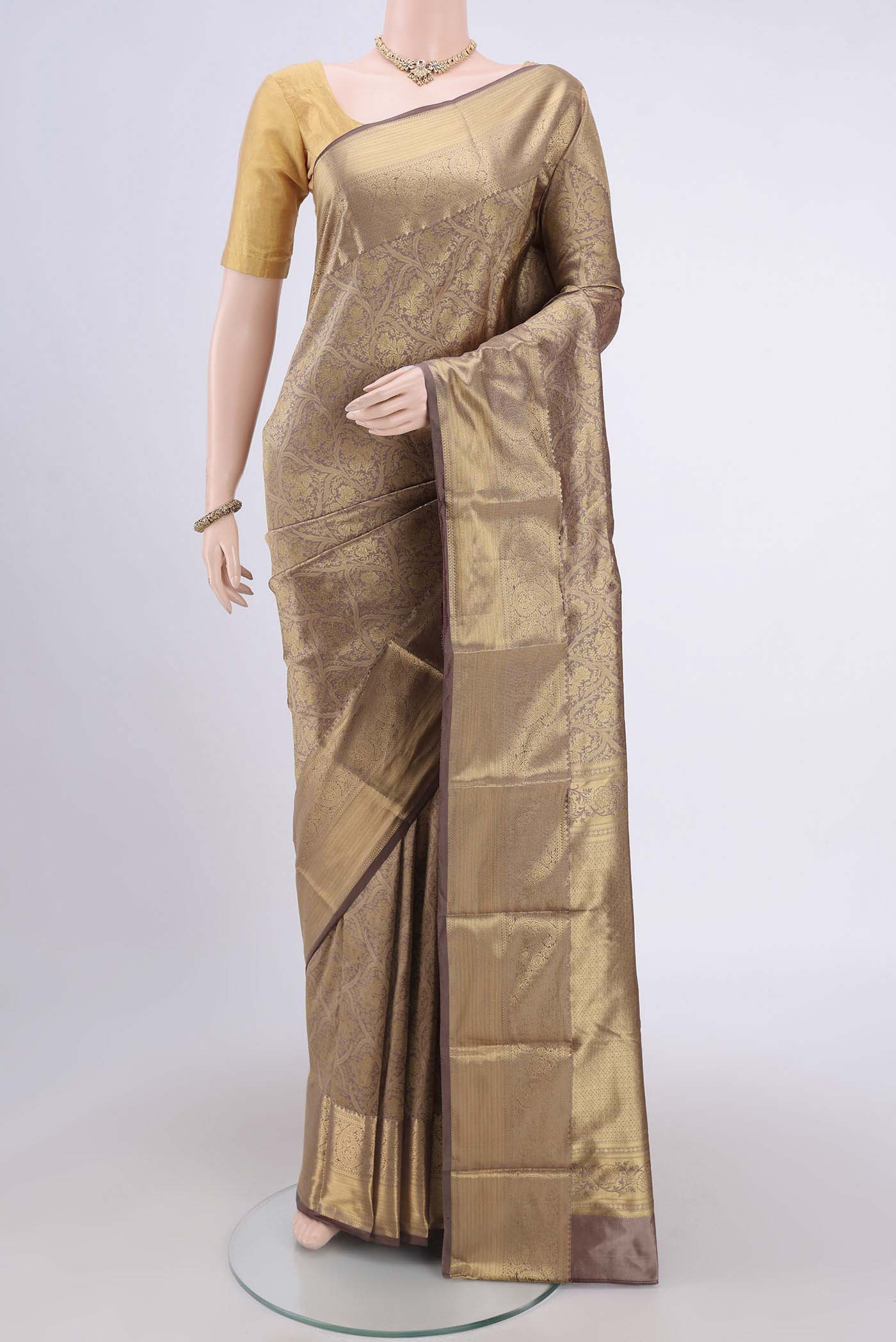Brown Dual Tone Bangalore Silk Saree with Zari Brocade on the body and Zari Border.  displayed on a mannequin