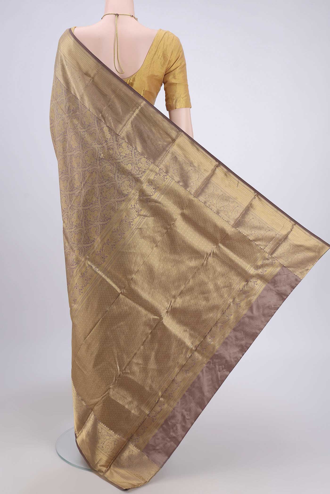 Flat view of Brown Dual Tone Bangalore Silk Saree with Zari Brocade on the body and Zari Border. 