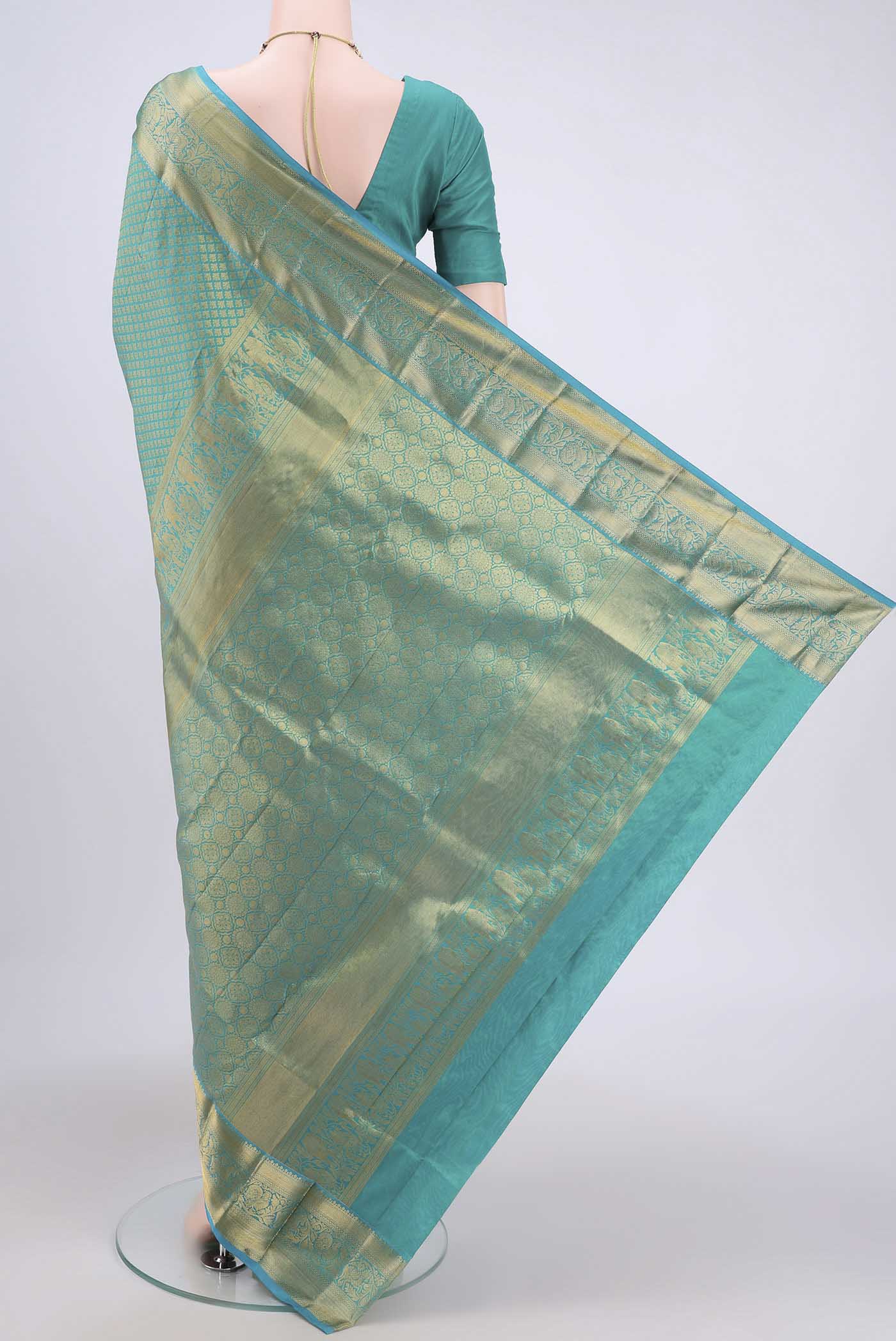 Flat view of Sea Green Dual Tone Bangalore Silk Saree with Zari Brocade on the body and Zari Border. 