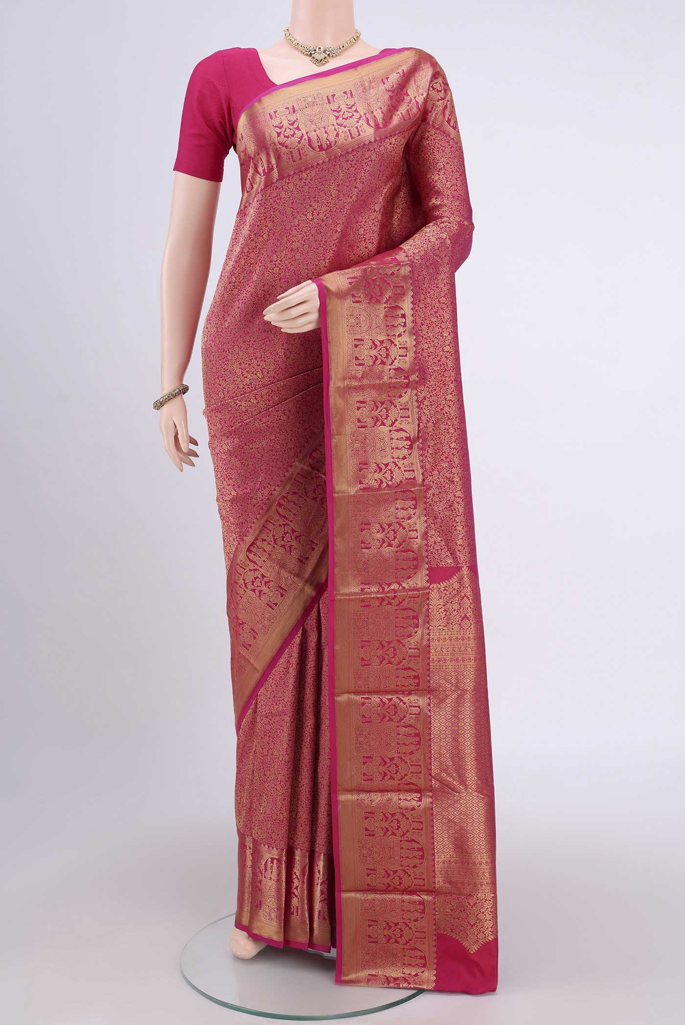 Rani Pink Dual Tone Bangalore Silk Saree with Zari Brocade on the body and Zari Border.  displayed on a mannequin