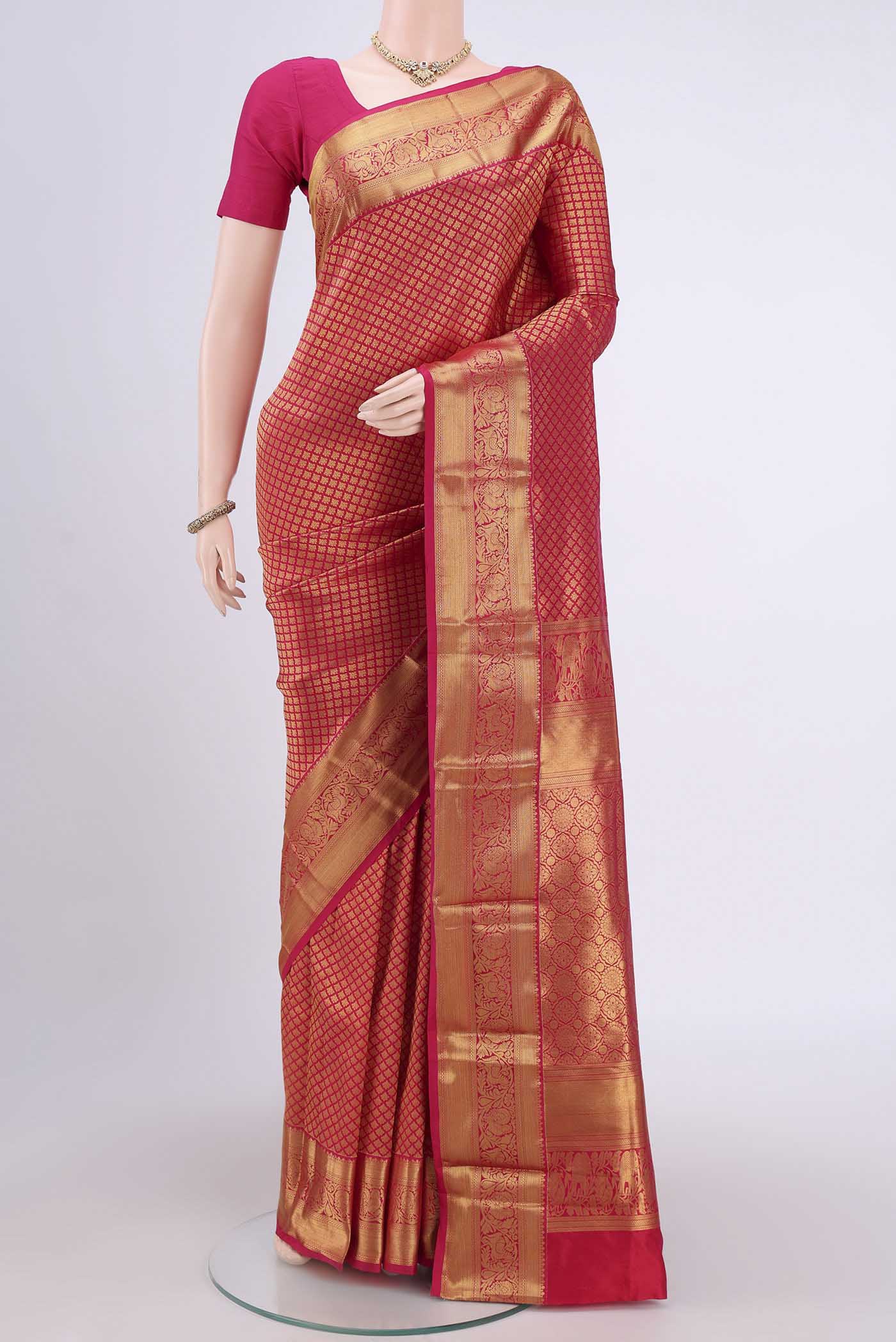 Dark Pink Bangalore Silk Saree with Zari Brocade on the body and Zari Border.  displayed on a mannequin