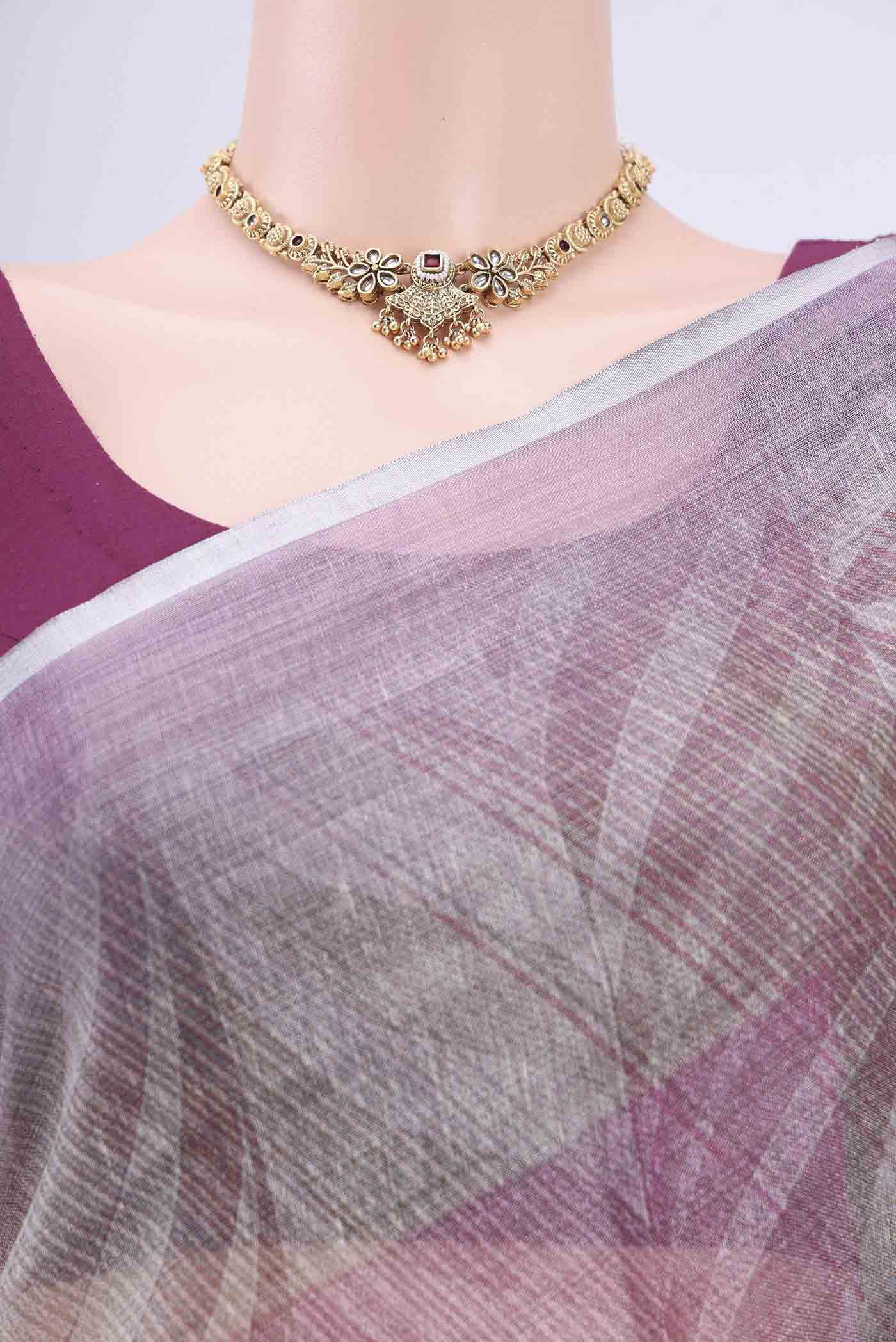 Border image of Mauve Linen Cotton Saree with Floral Print on the body and Zari Border. 