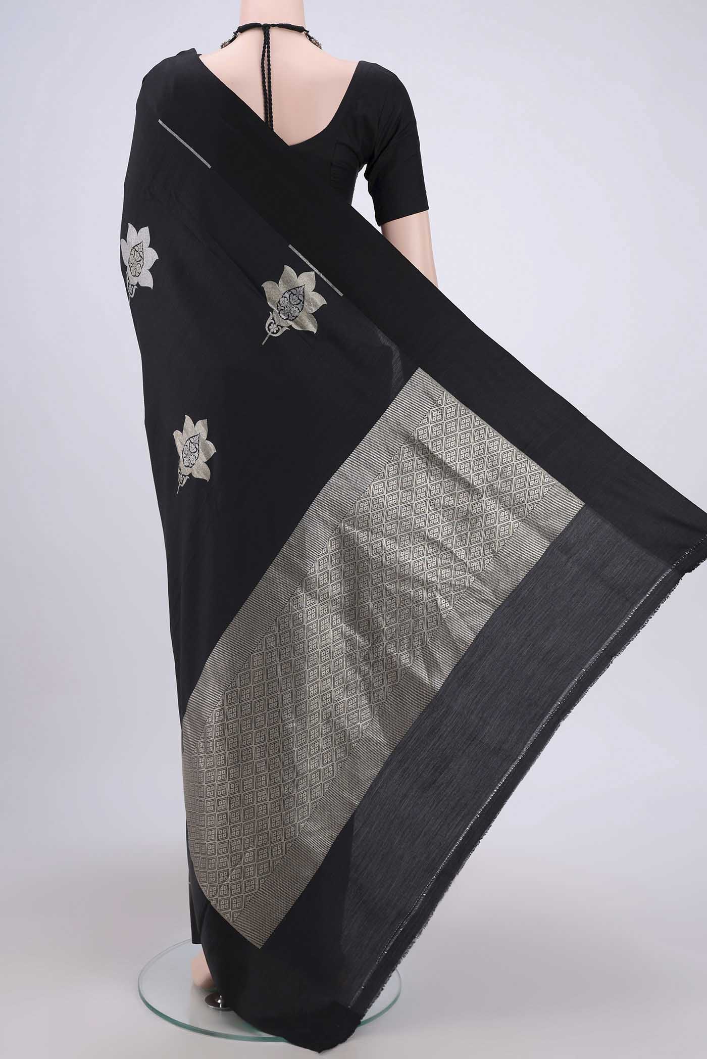 Flat view of Black Banarasi Silk Saree with Zari Butta on the body and Zari Border. 
