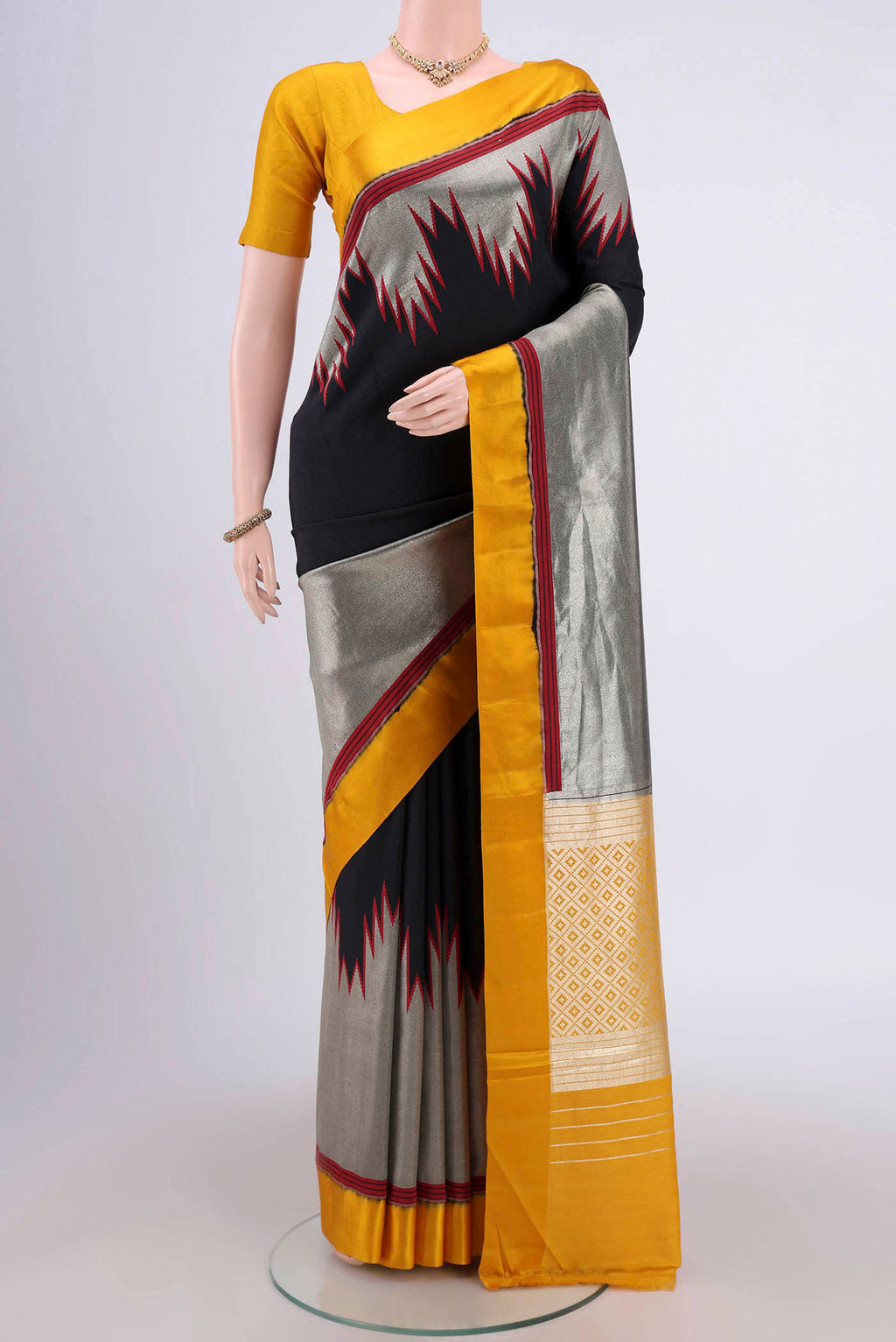 Black Banarasi Silk Saree with Zari Butta on the body and Zari Border.  displayed on a mannequin
