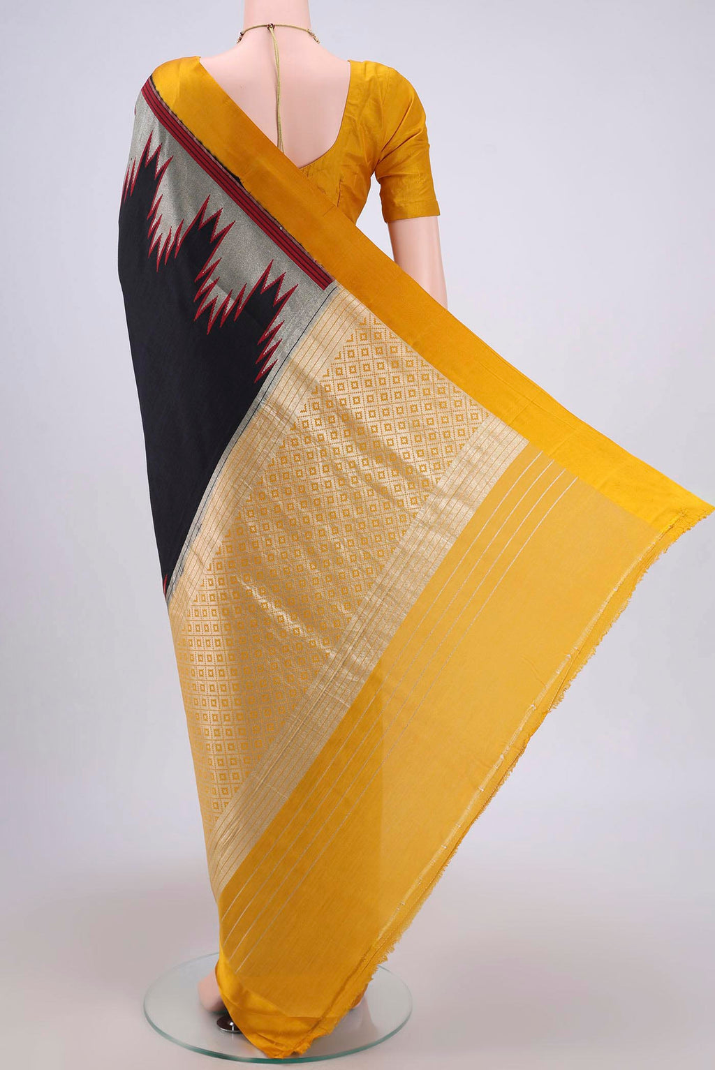 Flat view of Black Banarasi Silk Saree with Zari Butta on the body and Zari Border. 