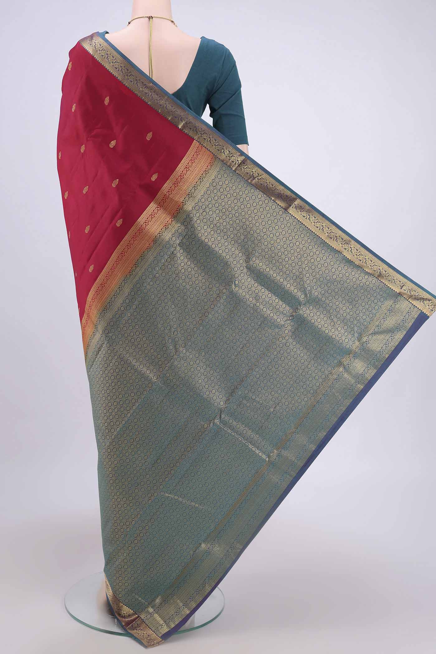 Flat view of Dark Pink Nangavalli Silk [ Salem ] Saree with Zari Butta on the body and Zari Border. 