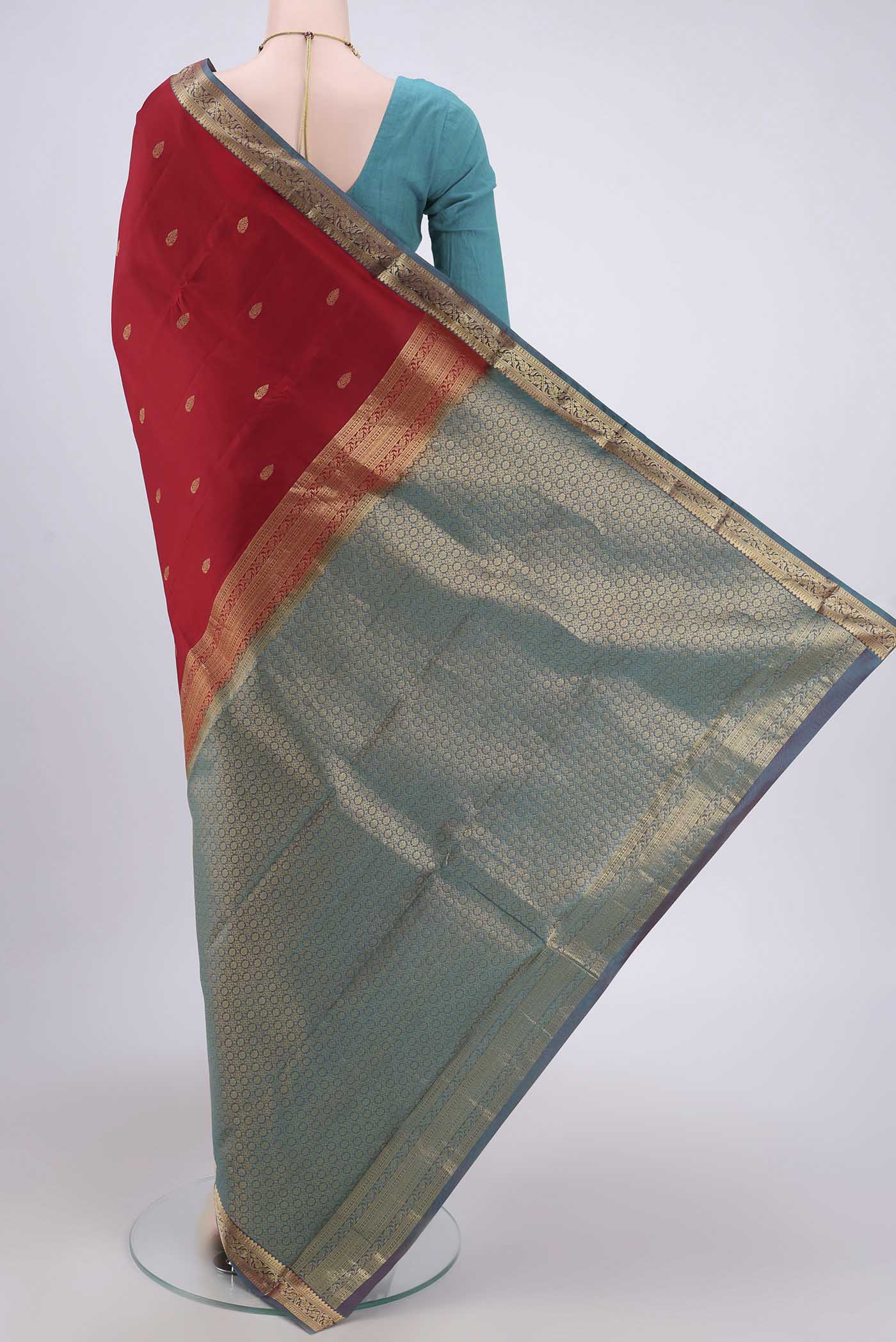 Flat view of Maroon Dual Tone Nangavalli Silk [ Salem ] Saree with Zari Butta on the body and Zari Border. 