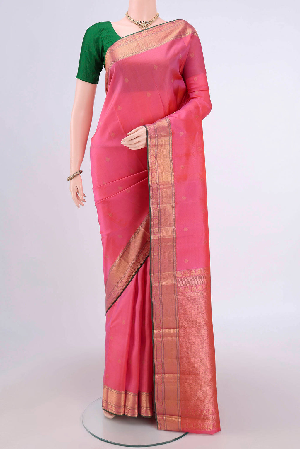 Pink Dual Tone Kanchipuram Silk Saree with Zari Butta on the body and Zari Border.  displayed on a mannequin