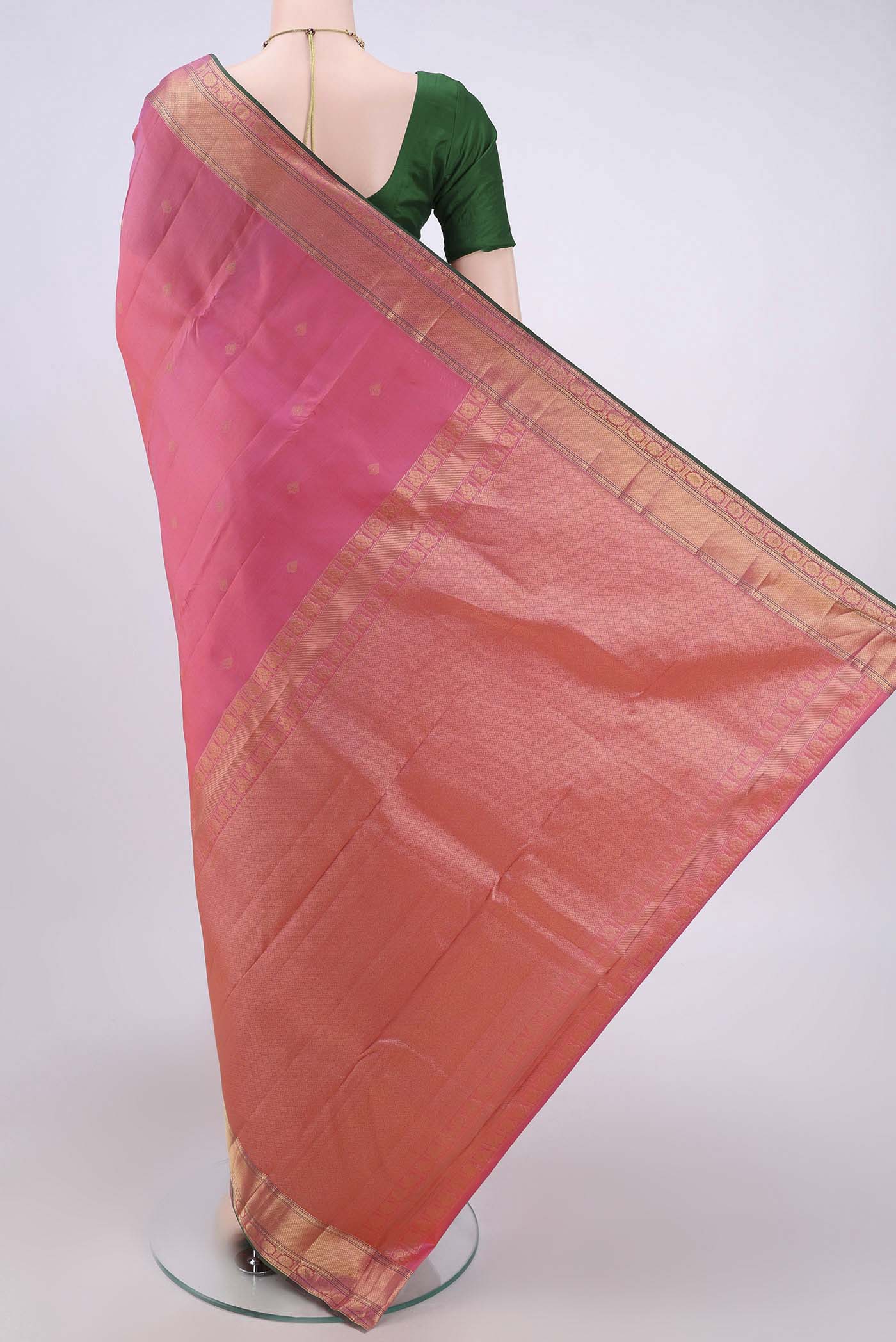 Flat view of Pink Dual Tone Kanchipuram Silk Saree with Zari Butta on the body and Zari Border. 