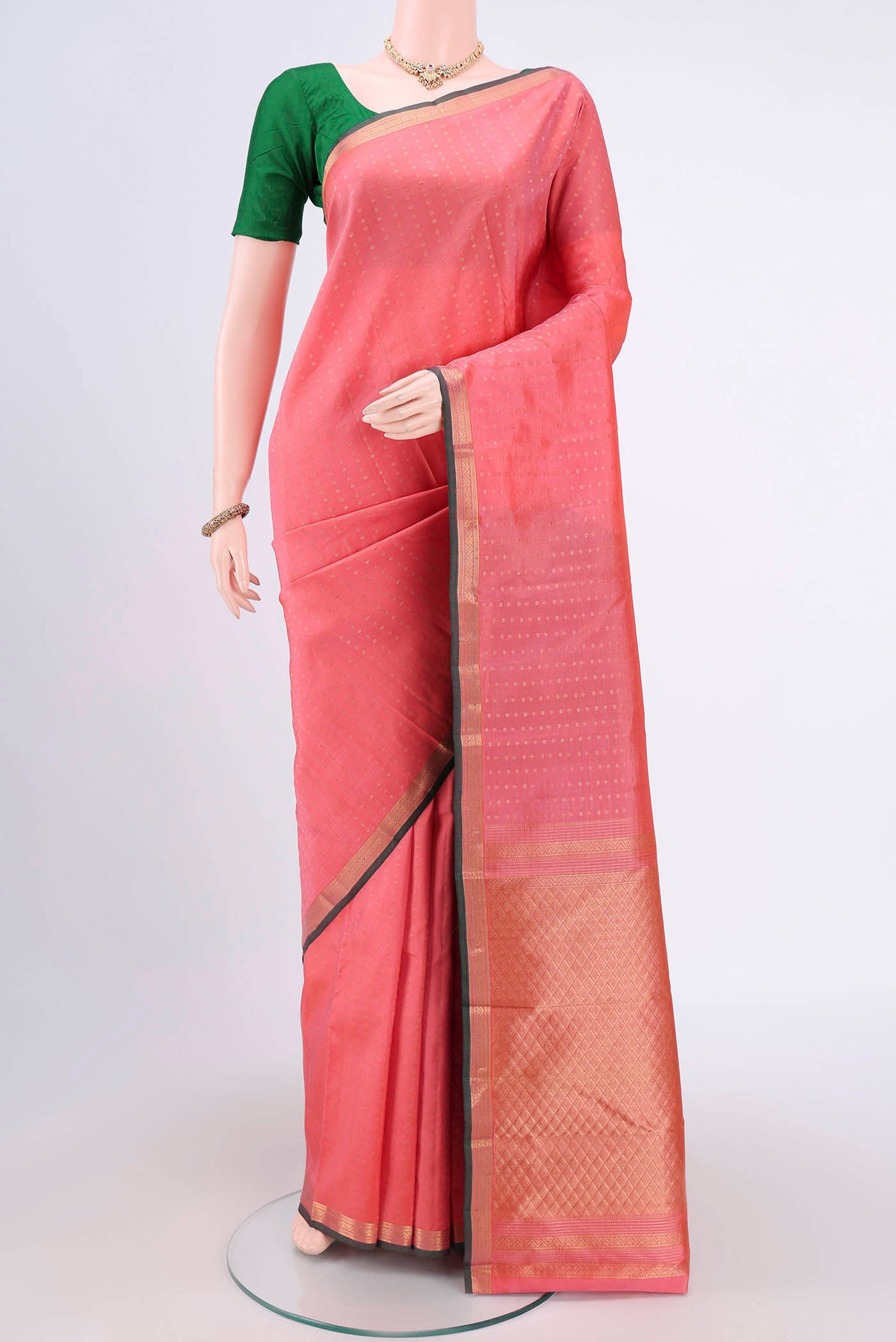 Peach Dual Tone Nangavalli Silk [ Salem ] Saree with Zari Butta on the body and Zari Border.  displayed on a mannequin