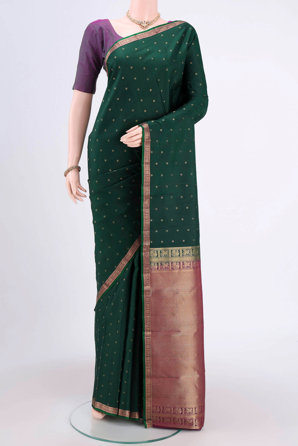 Bottle Green Dual Tone Nangavalli Silk [ Salem ] Saree with Zari Butta on the body and Zari Border.  displayed on a mannequin