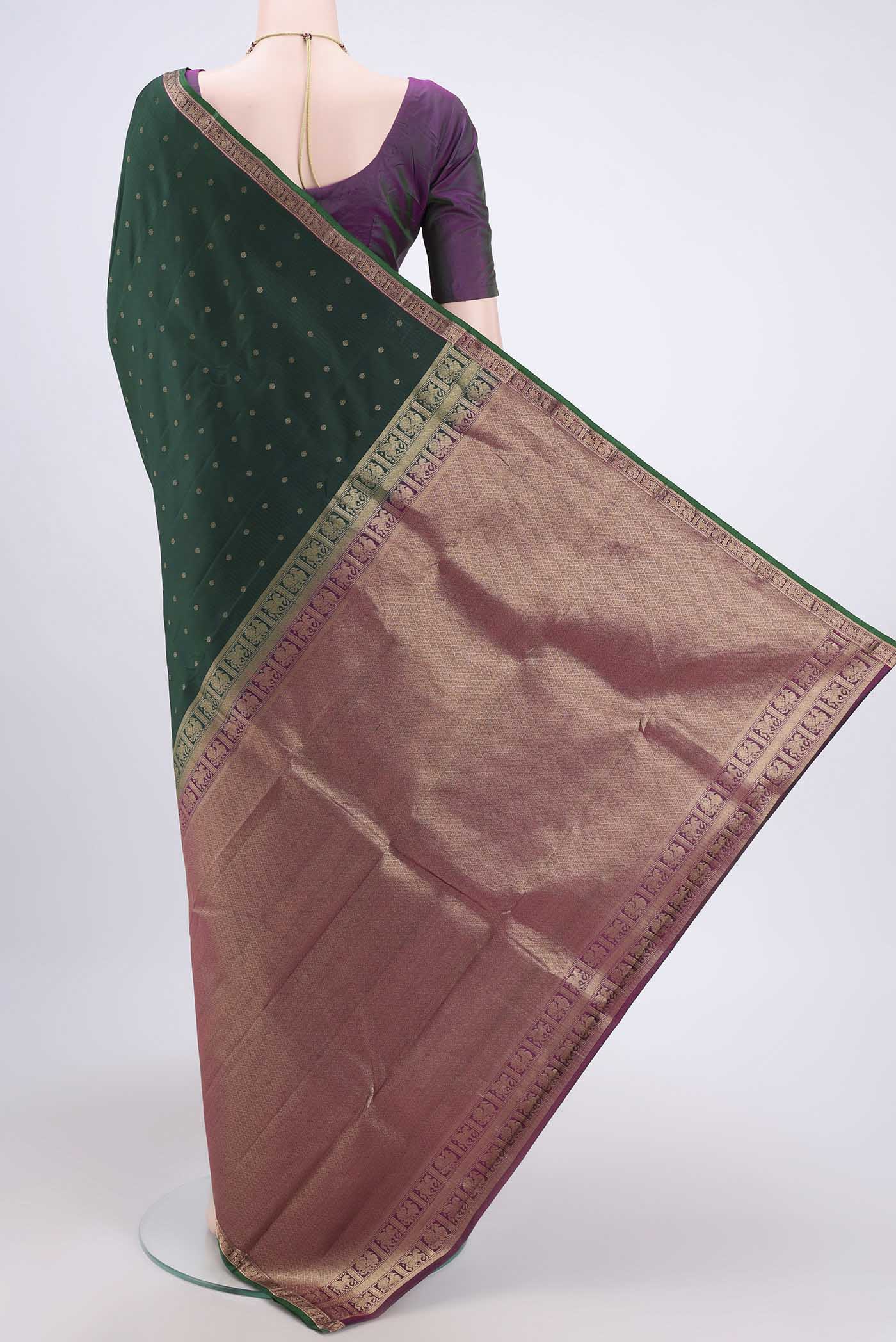 Flat view of Bottle Green Dual Tone Nangavalli Silk [ Salem ] Saree with Zari Butta on the body and Zari Border. 