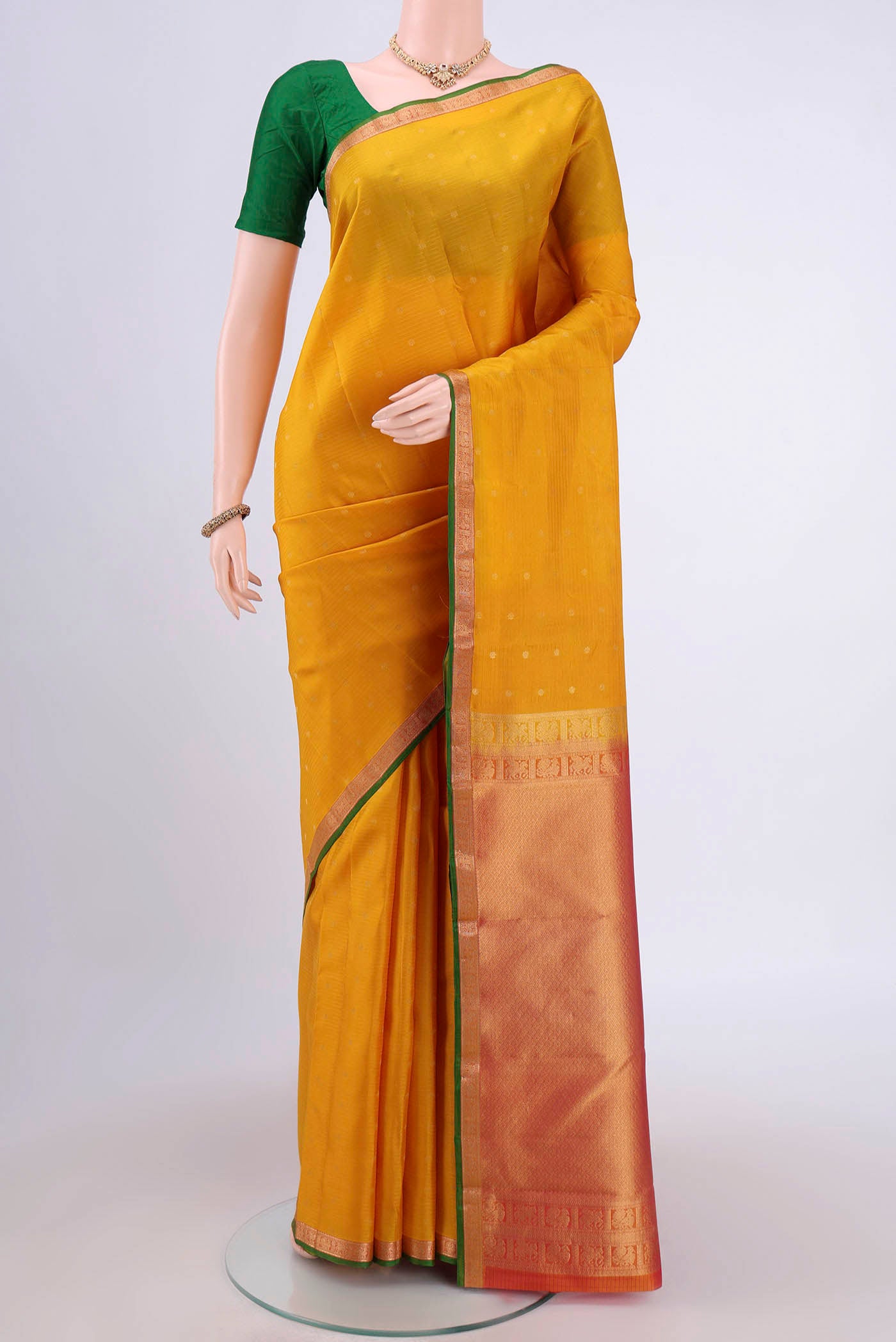 Yellow Nangavalli Silk [ Salem ] Saree with Zari Butta on the body and Zari Border.  displayed on a mannequin