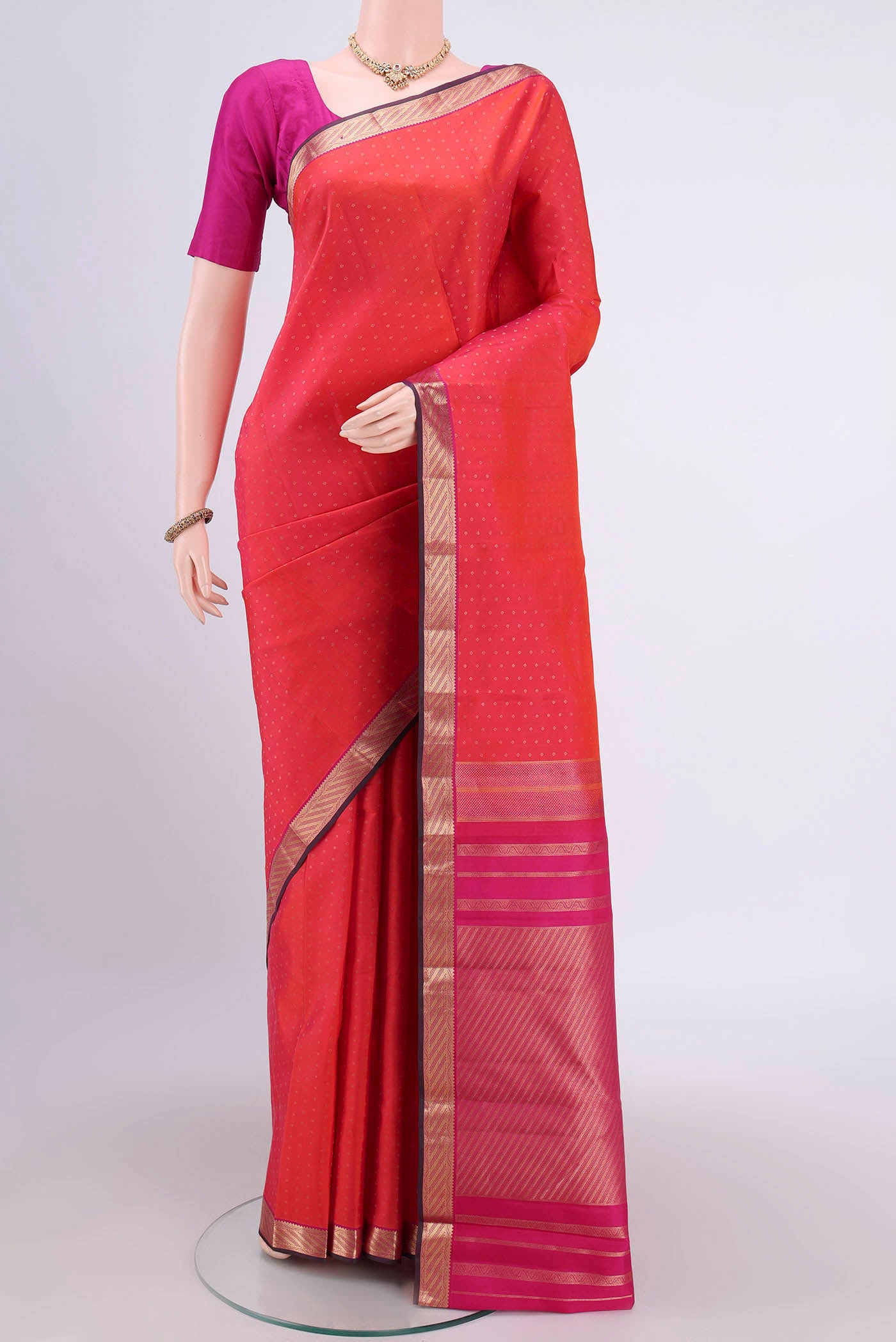 Rust Dual Tone Nangavalli Silk [ Salem ] Saree with Zari Butta on the body and Zari Border.  displayed on a mannequin