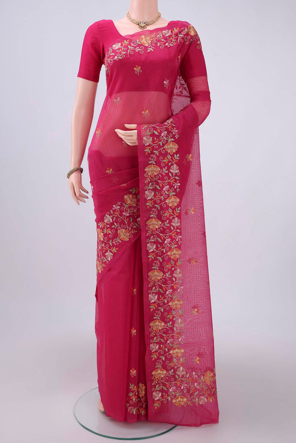 Pink Coimbatore Silk Cotton Saree with Embroidery on the body and Plain Border.  displayed on a mannequin