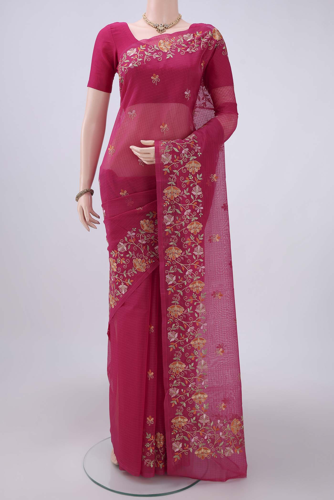 Pink Coimbatore Silk Cotton Saree with Embroidery on the body and Plain Border.  displayed on a mannequin