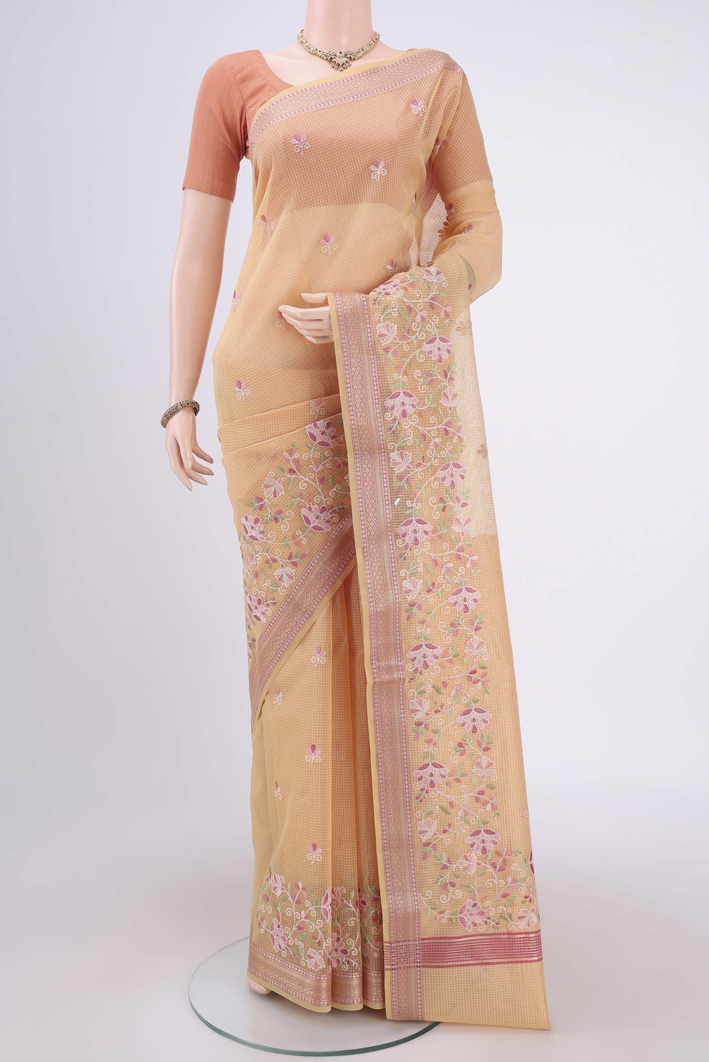 Yellow Coimbatore Silk Cotton Saree with Embroidery on the body and Plain Border.  displayed on a mannequin