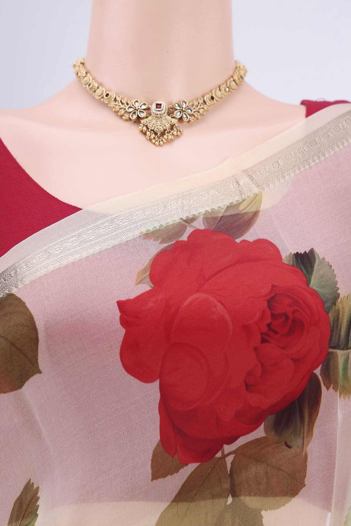 Border image of Off White Organza Silk Saree with Floral Print on the body and Zari Border. 