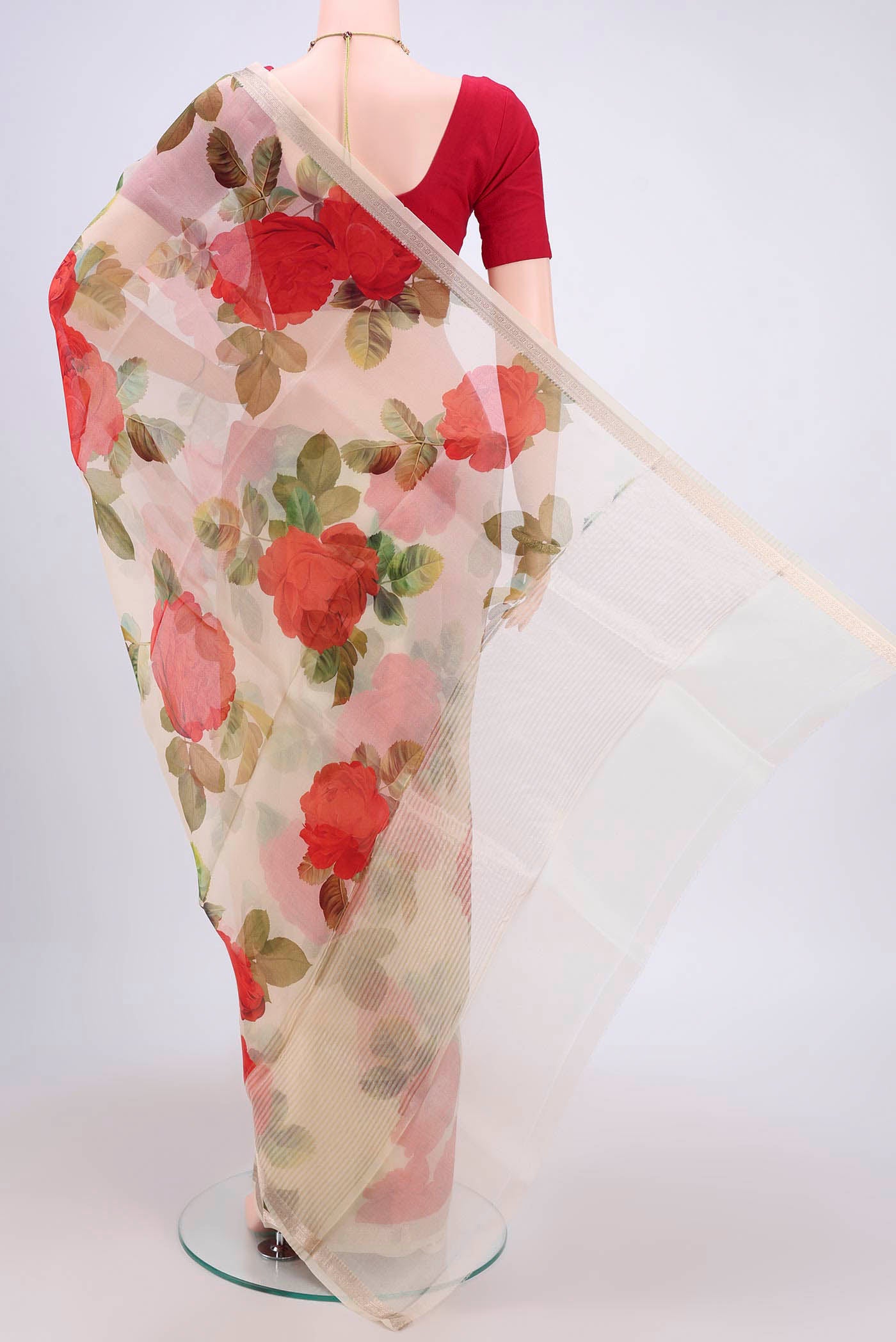 Flat view of Off White Organza Silk Saree with Floral Print on the body and Zari Border. 