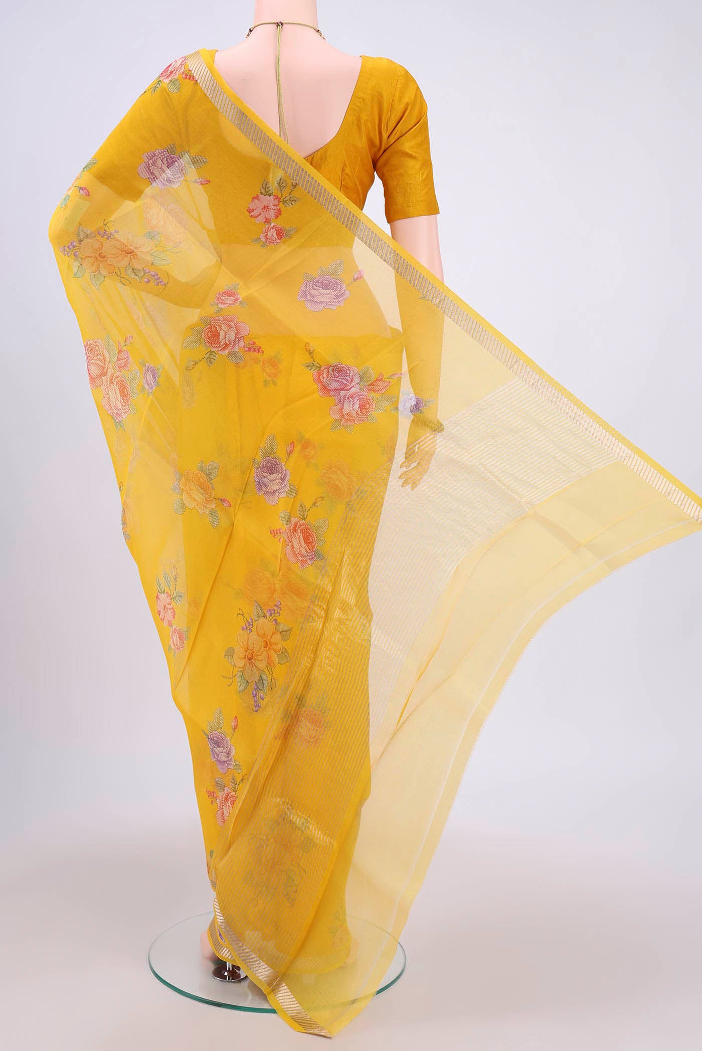 Flat view of Yellow Organza Silk Saree with Lehariya on the body and Zari Border. 
