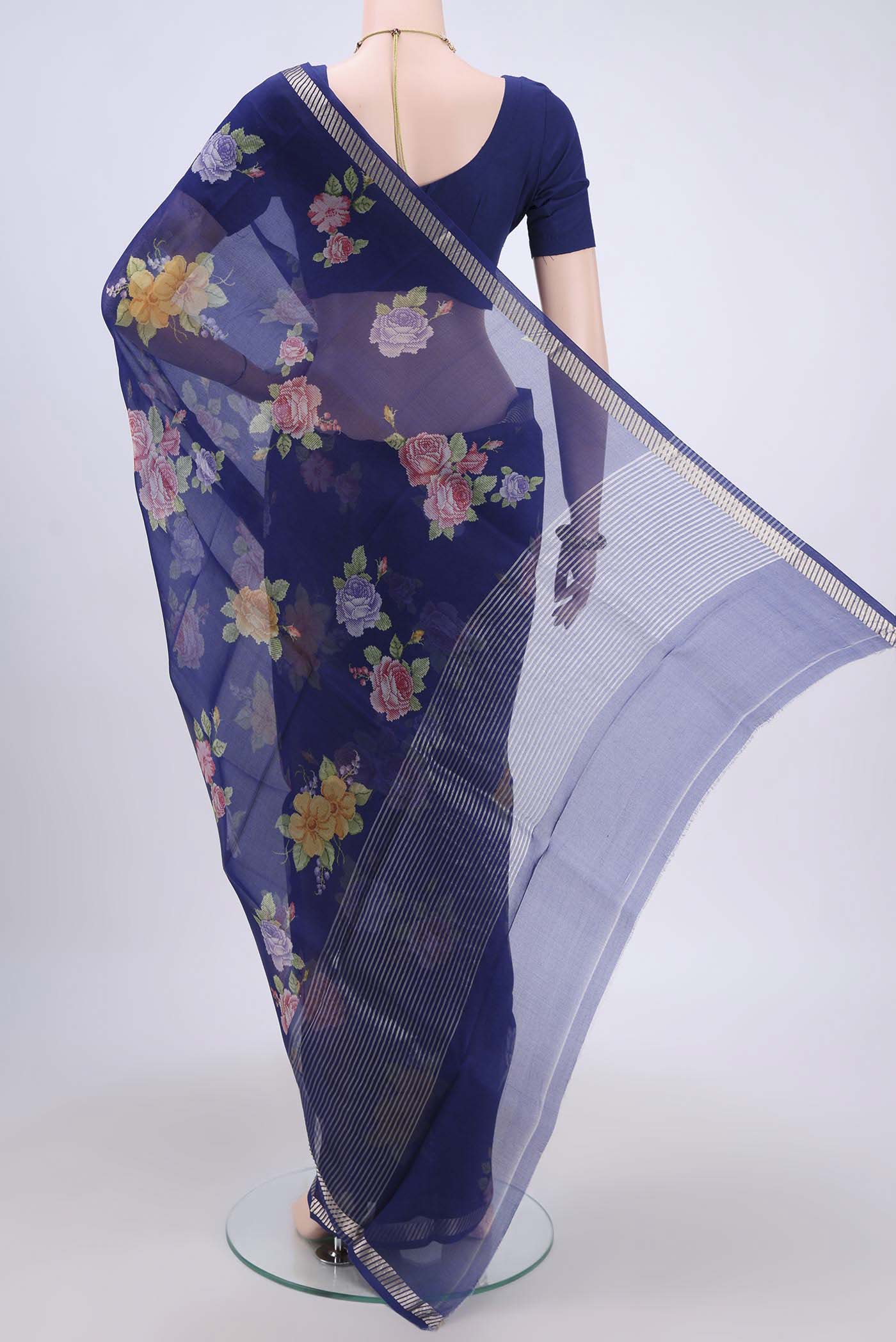 Flat view of Royal Blue Organza Silk Saree with Floral Print on the body and Zari Border. 