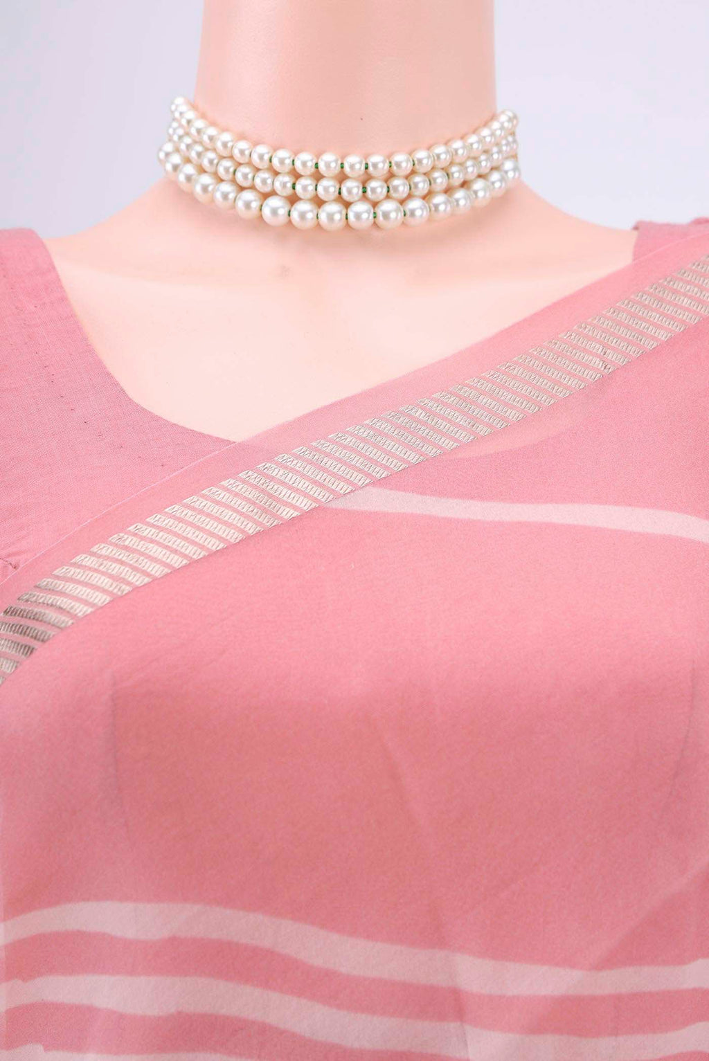 Border image of Peach Organza Silk Saree with Floral Print on the body and Zari Border. 