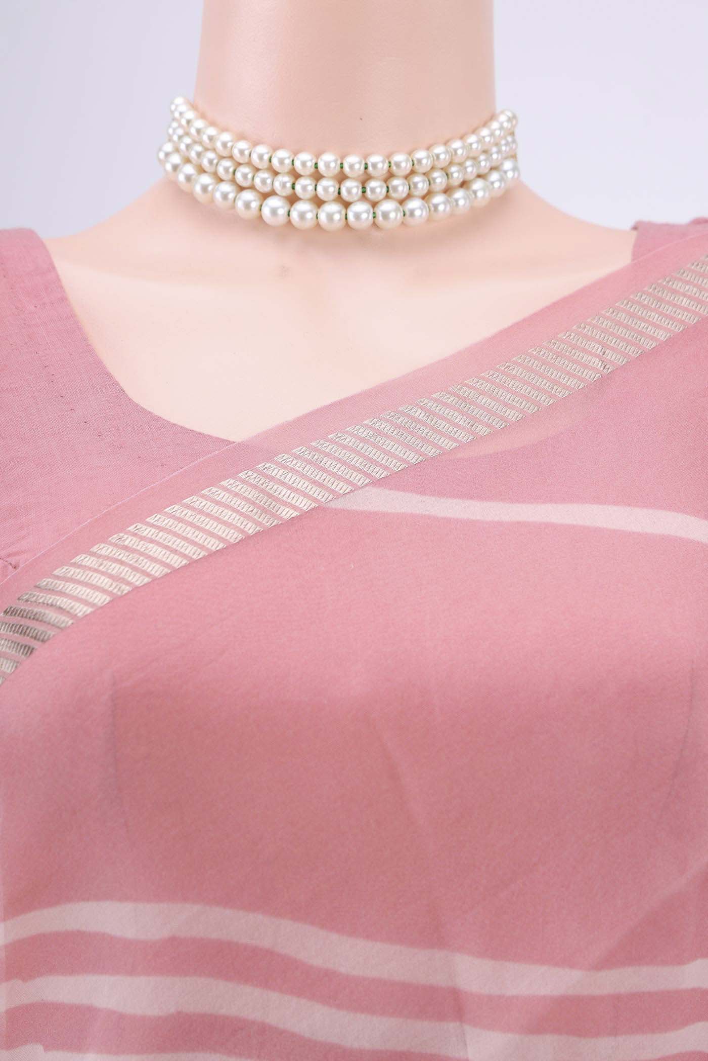 Border image of Peach Organza Silk Saree with Floral Print on the body and Zari Border. 