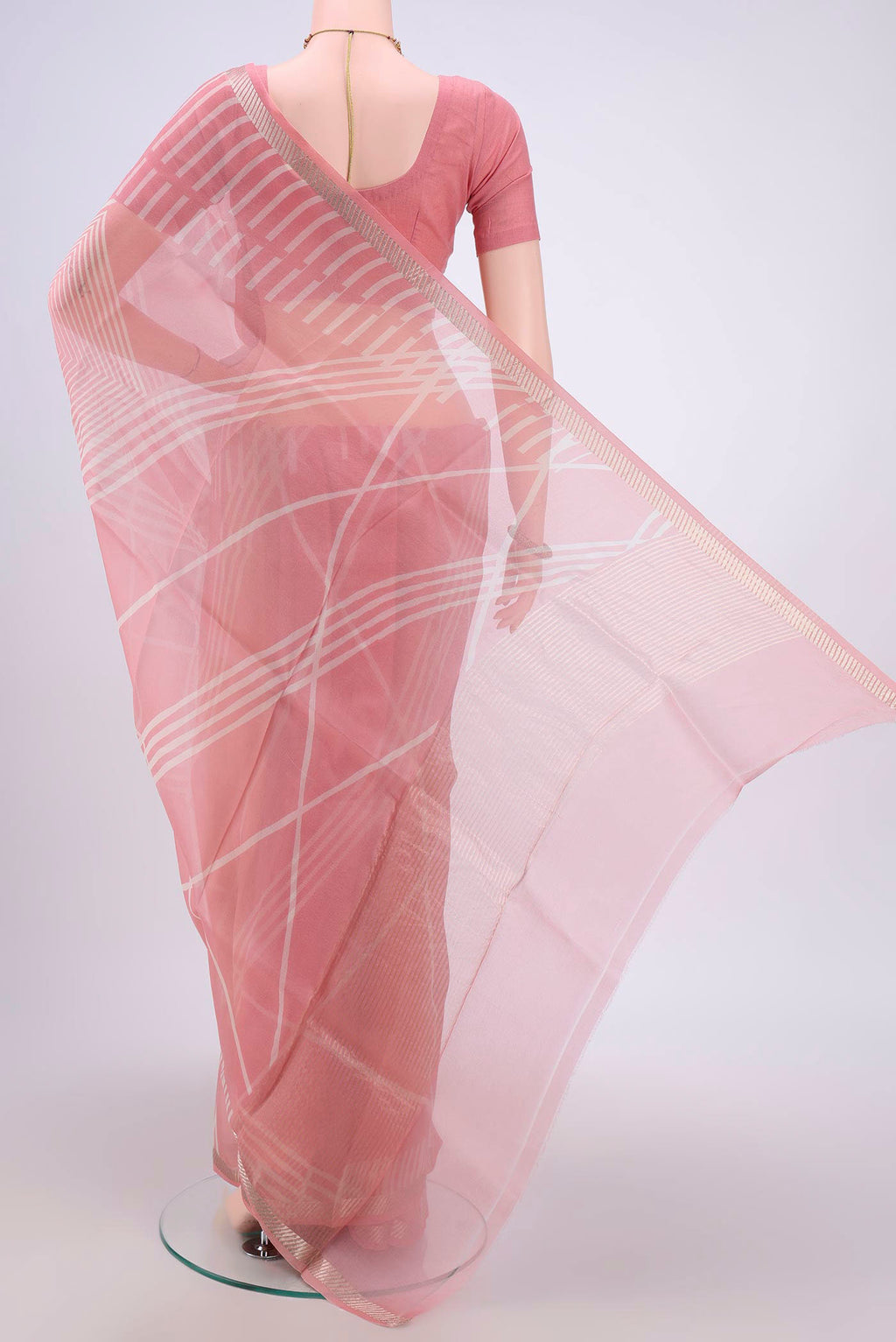 Flat view of Peach Organza Silk Saree with Floral Print on the body and Zari Border. 