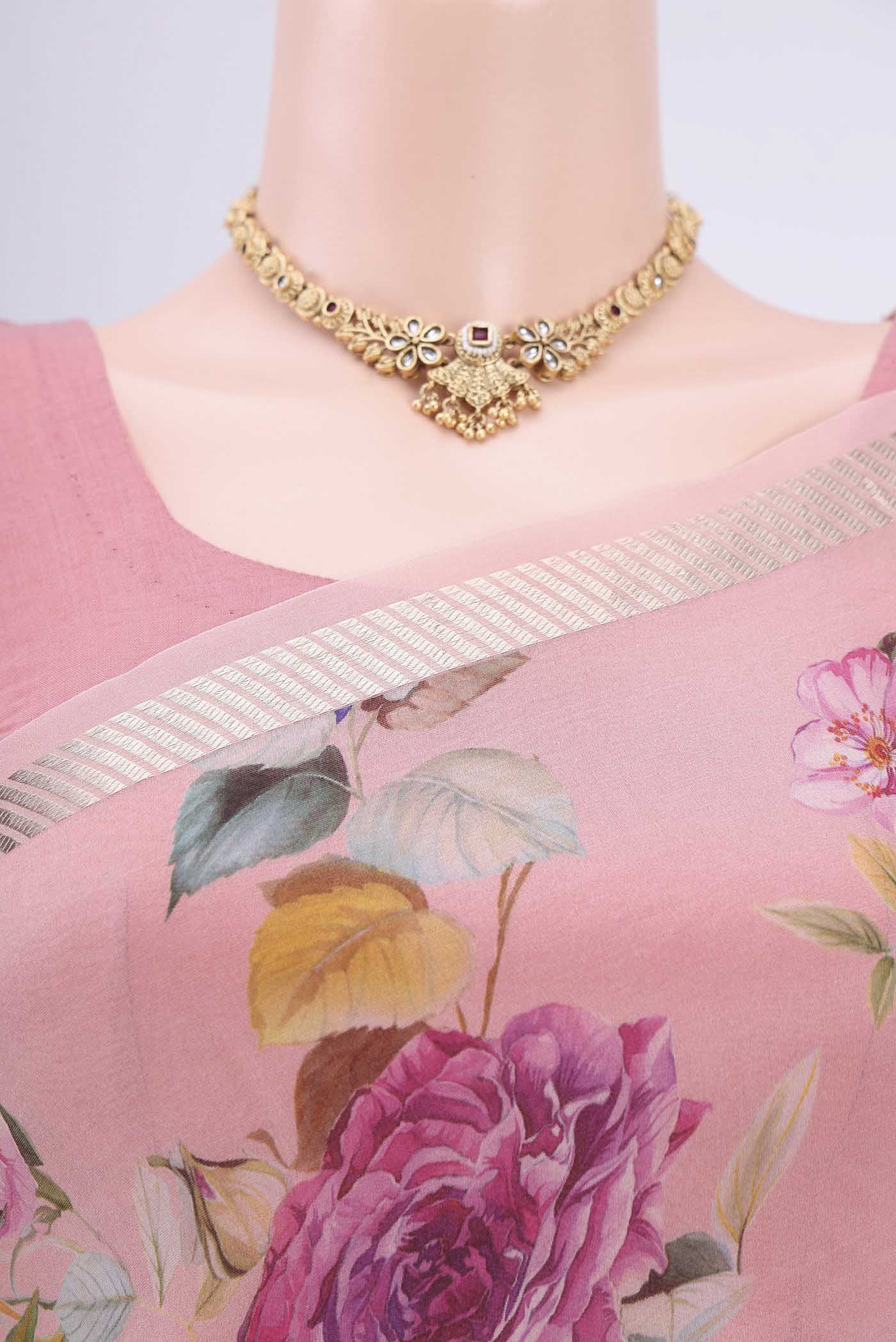 Border image of Rani Pink Organza Silk Saree with Floral Print on the body and Zari Border. 