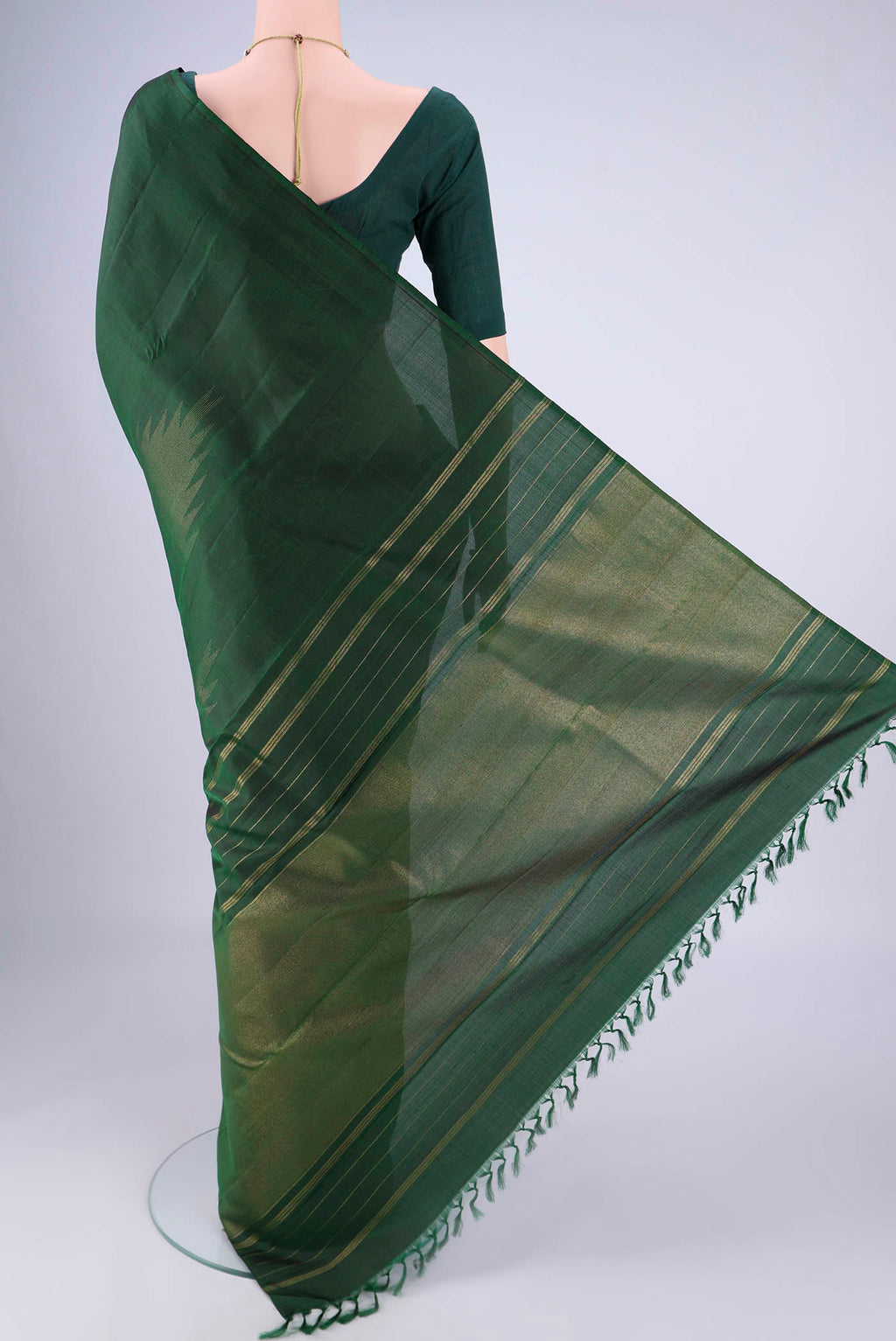 Flat view of Bottle Green Kanchipuram Silk Saree with Plain Body and Temple Border. 