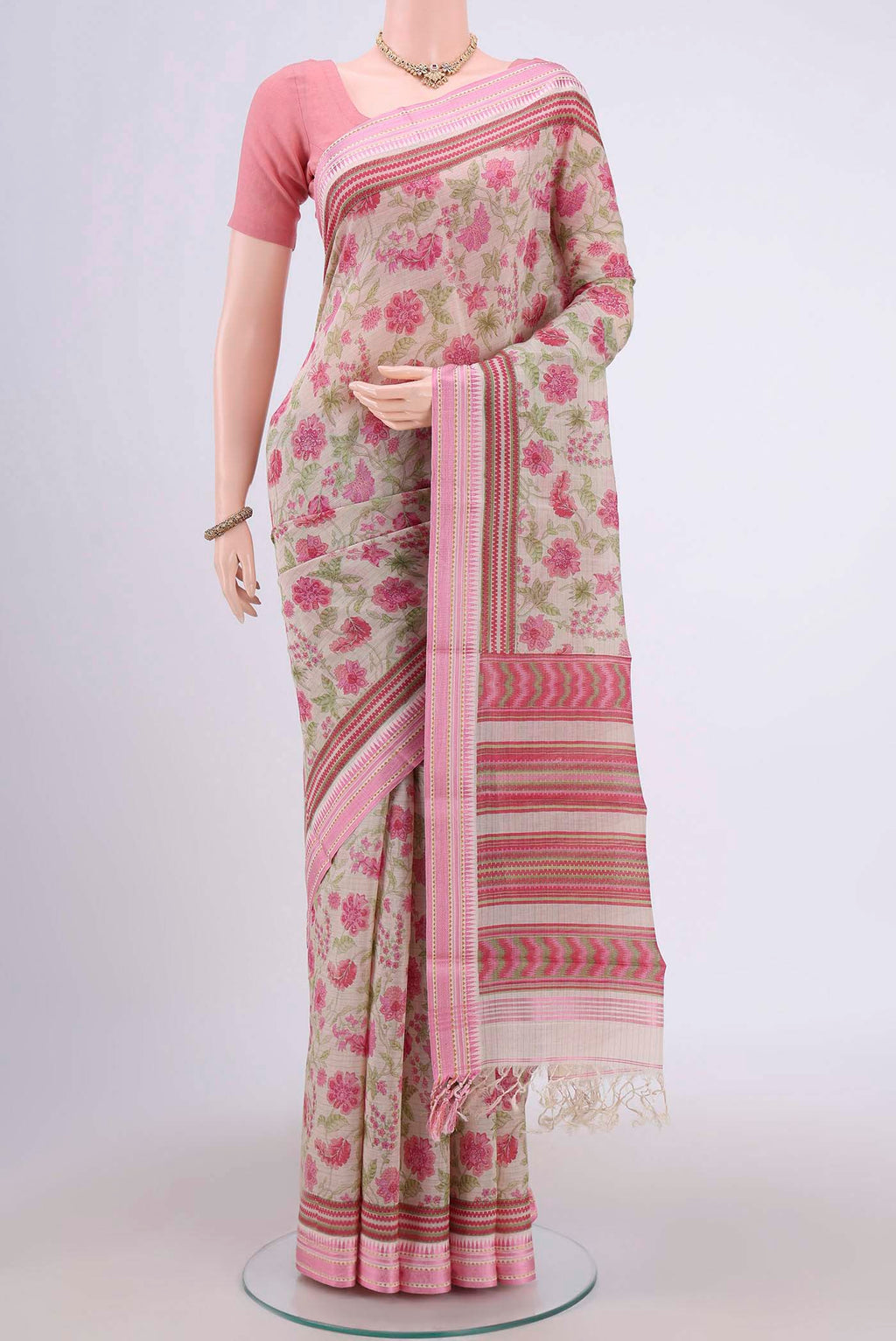 Beige Tussar Saree with Floral Print on the body and Thread Border.  displayed on a mannequin
