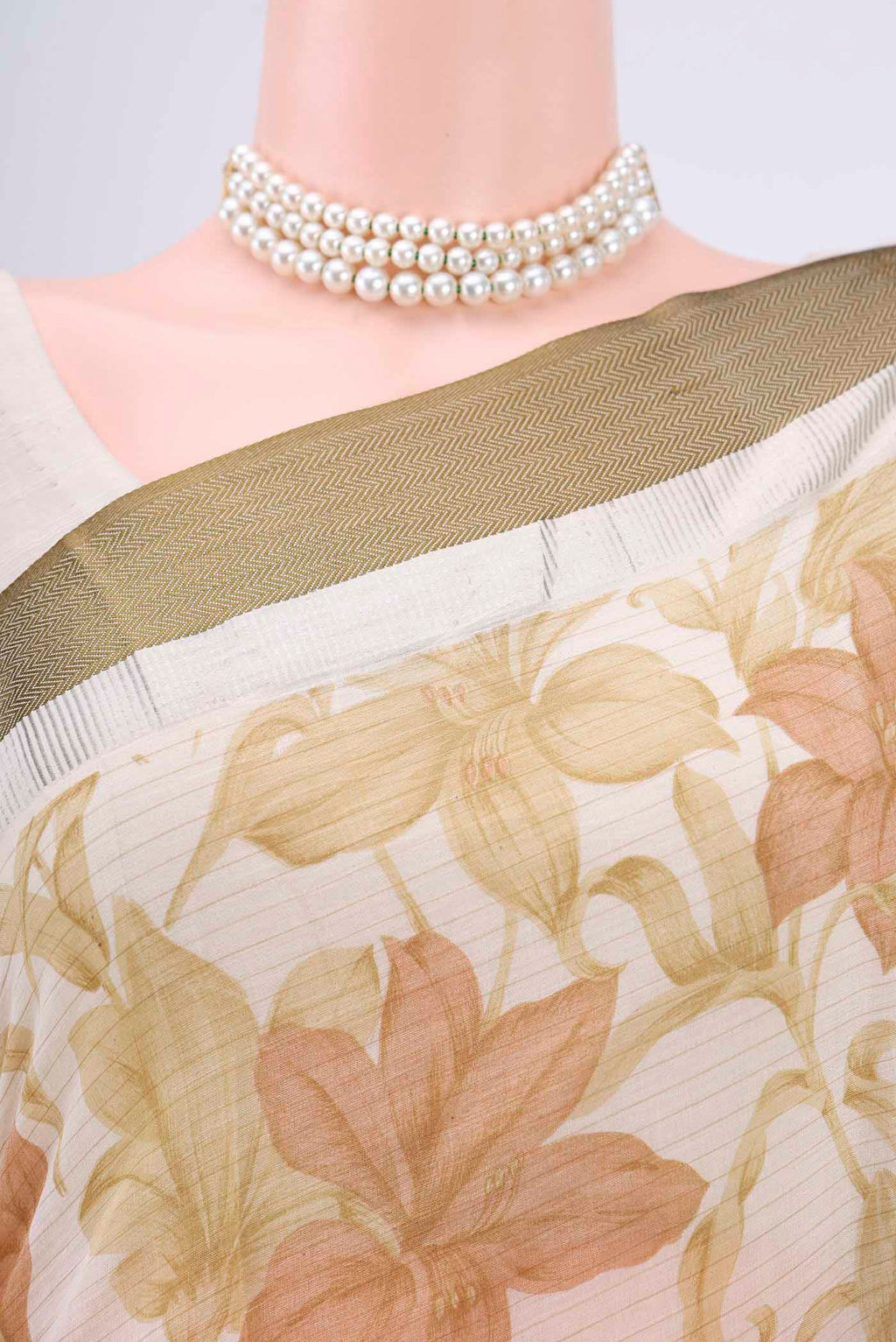 Border image of Off White Tussar Saree with Floral Print on the body and Plain Border. 