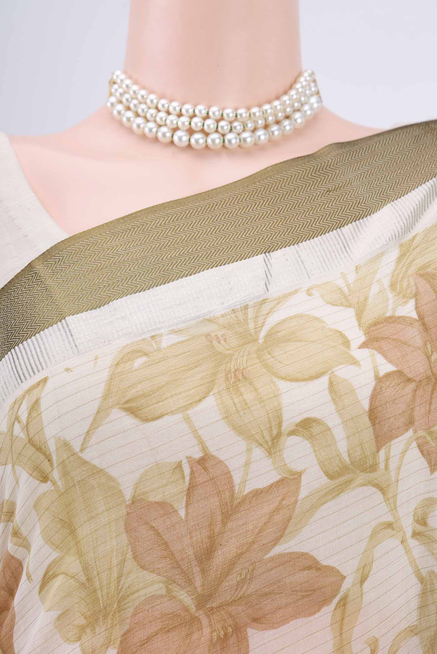 Border image of Off White Tussar Saree with Floral Print on the body and Plain Border. 