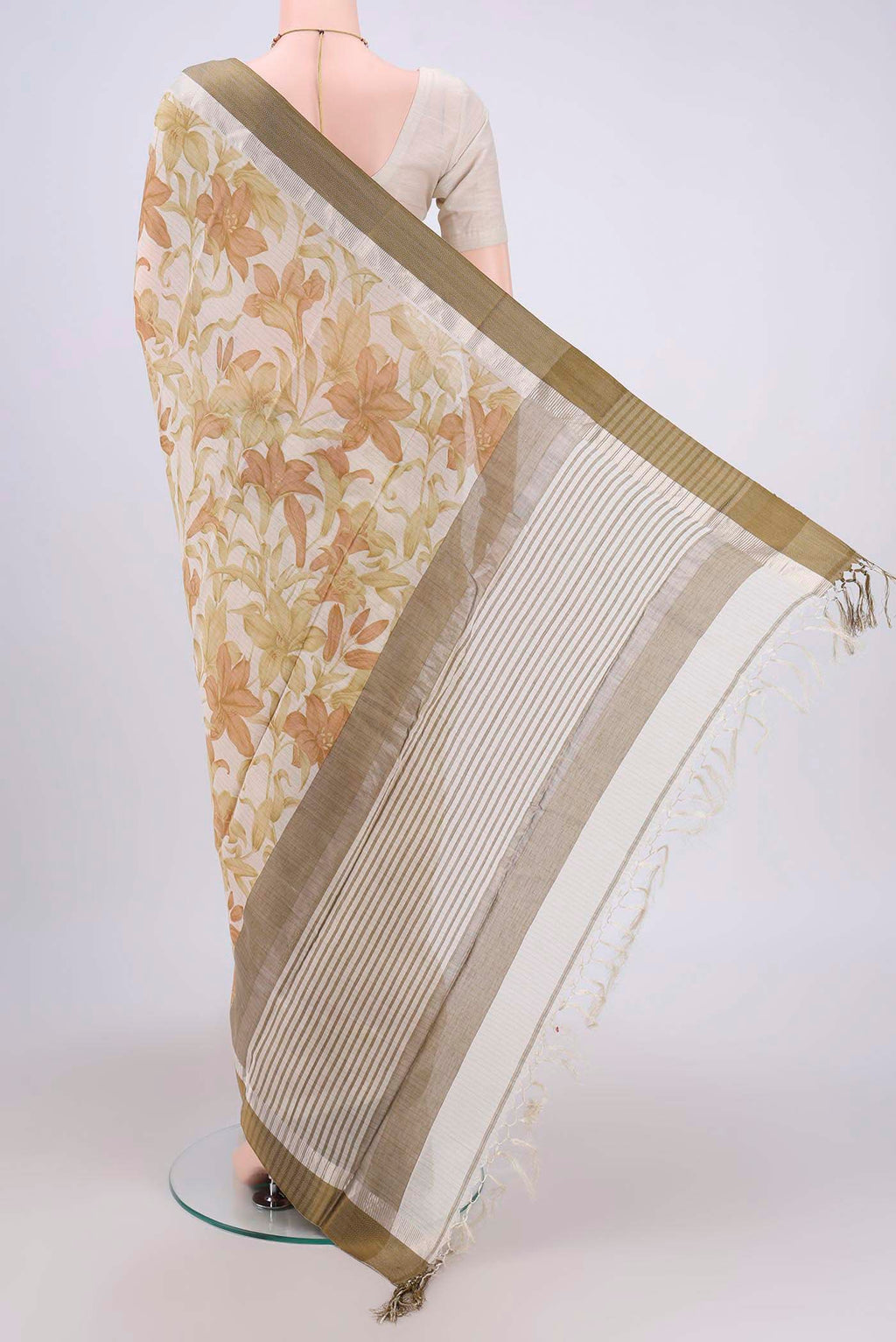 Flat view of Off White Tussar Saree with Floral Print on the body and Plain Border. 